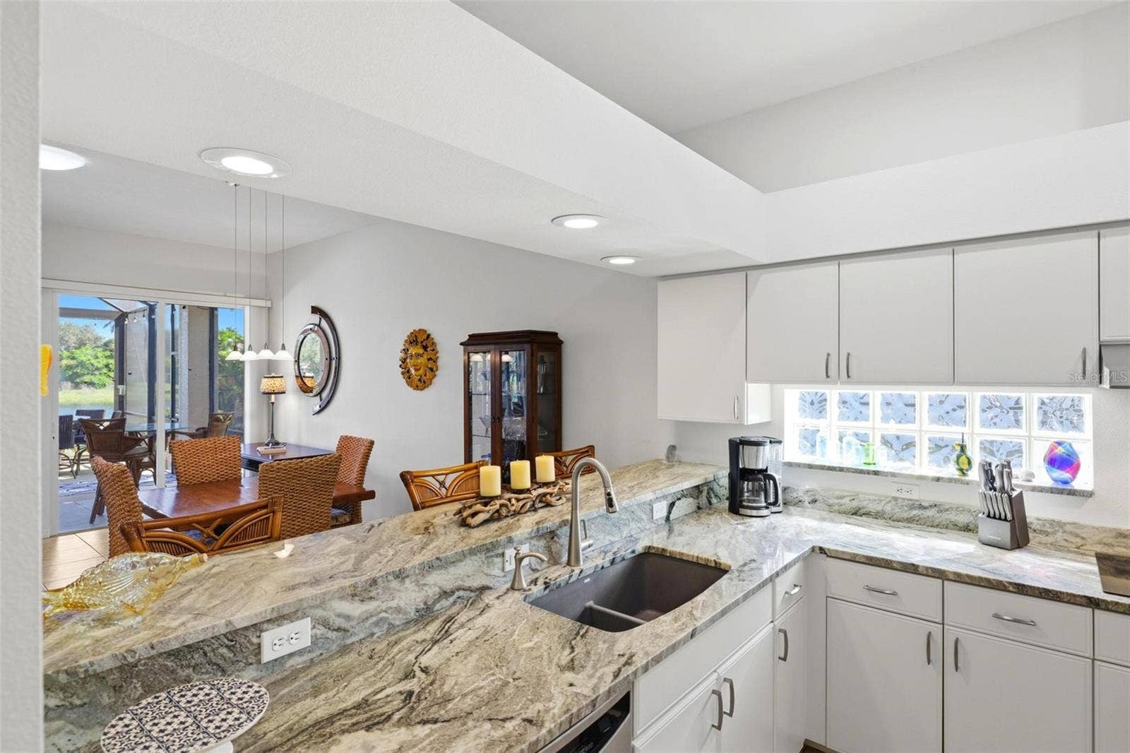 687 LAKESCENE DRIVE, Venice, FL 34293 Kitchen and breakfast bar open to dining and living areas