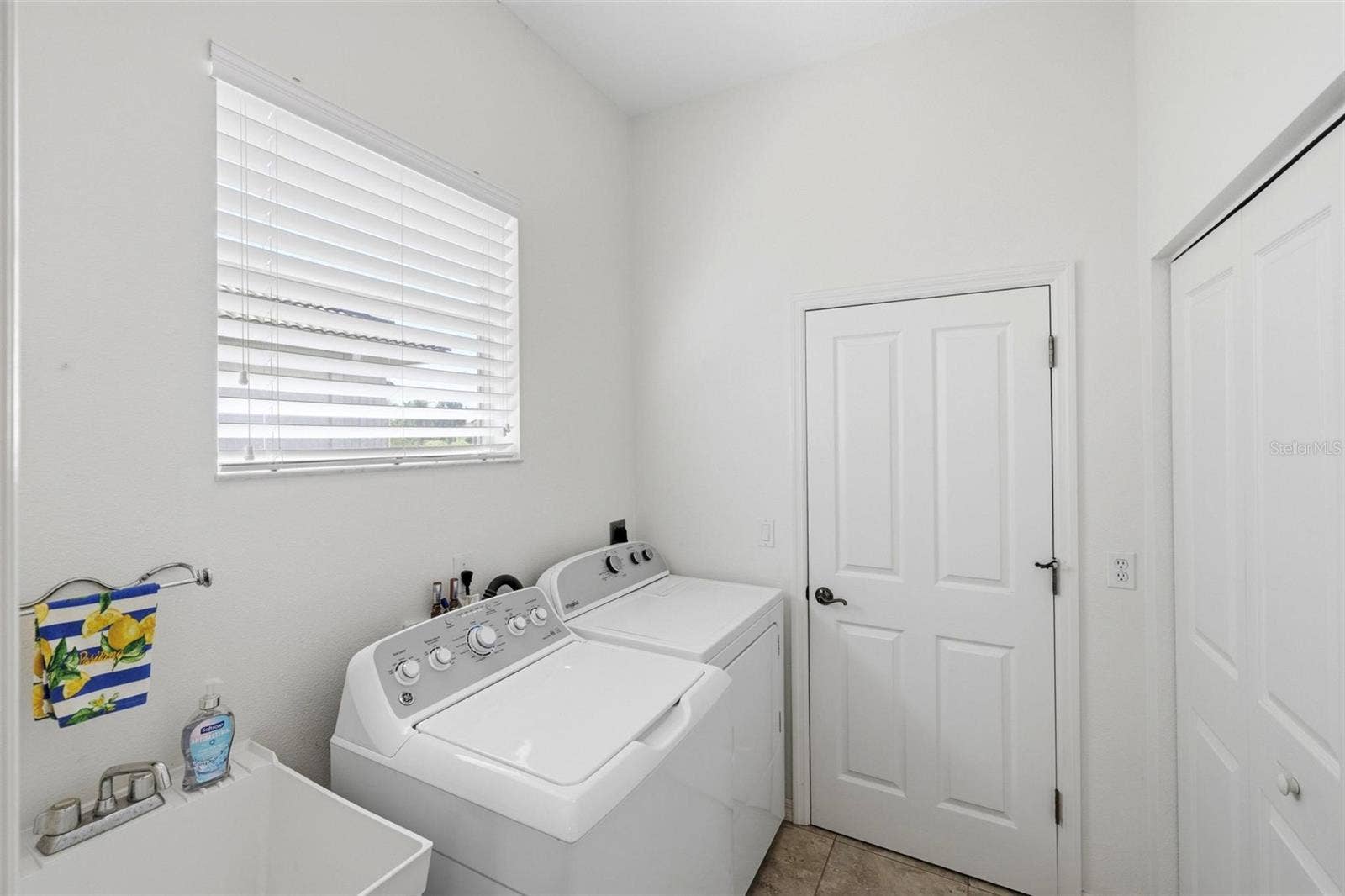 687 LAKESCENE DRIVE, Venice, FL 34293 Laundry room with large double closet - pantry/untility