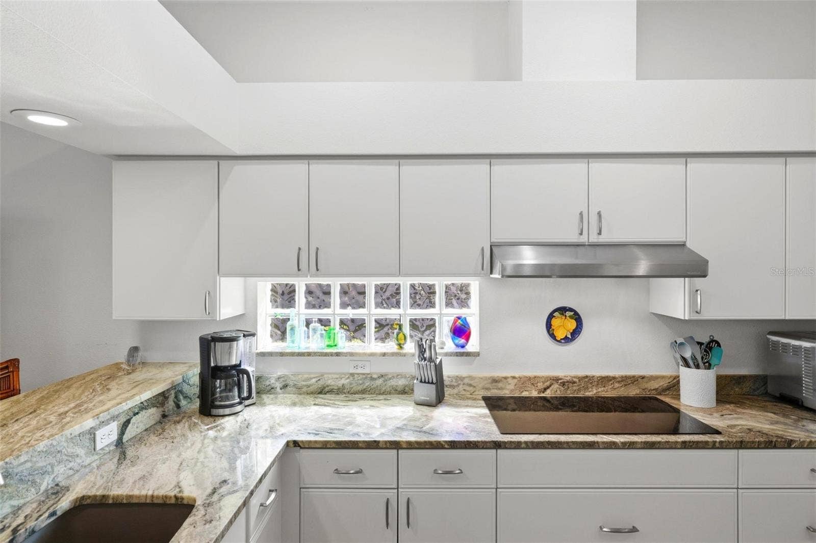 687 LAKESCENE DRIVE, Venice, FL 34293 Kitchen with granite counters, glass cooktop