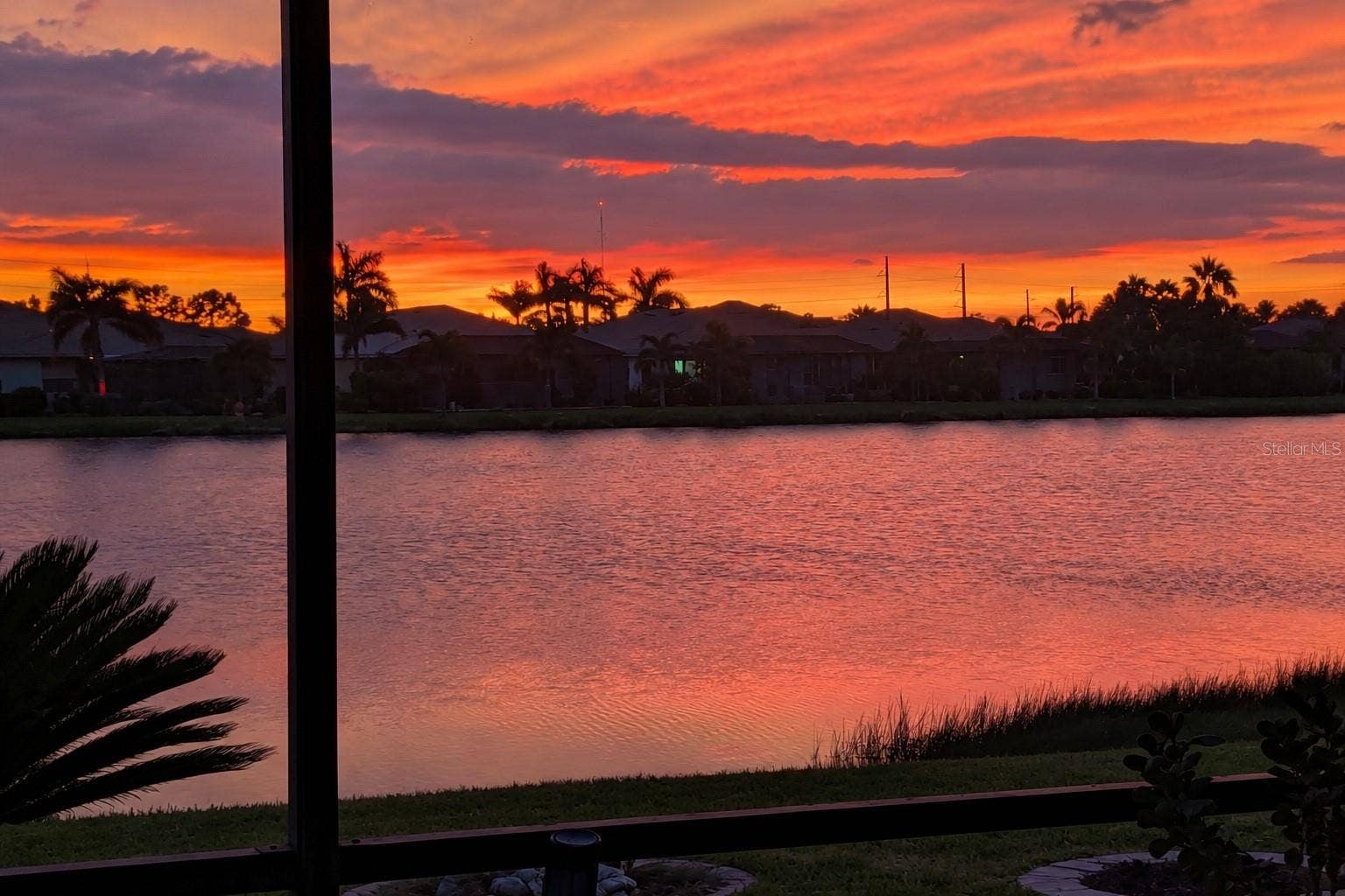 2216 WEAVER BIRD LANE, Venice, FL 34292 Spectacular sunset views over the lake from your screened lanai.