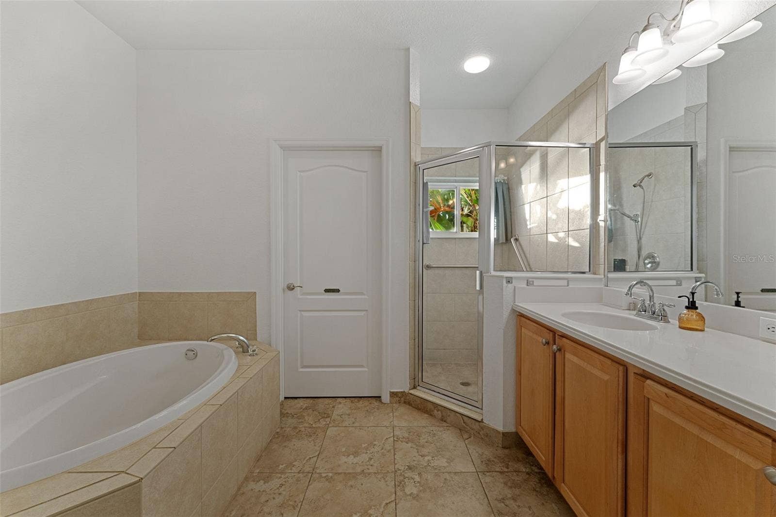 2216 WEAVER BIRD LANE, Venice, FL 34292 Ensuite Primary Bathroom with Soaking Garden Tub, Separate Shower Stall and Private Water Closet