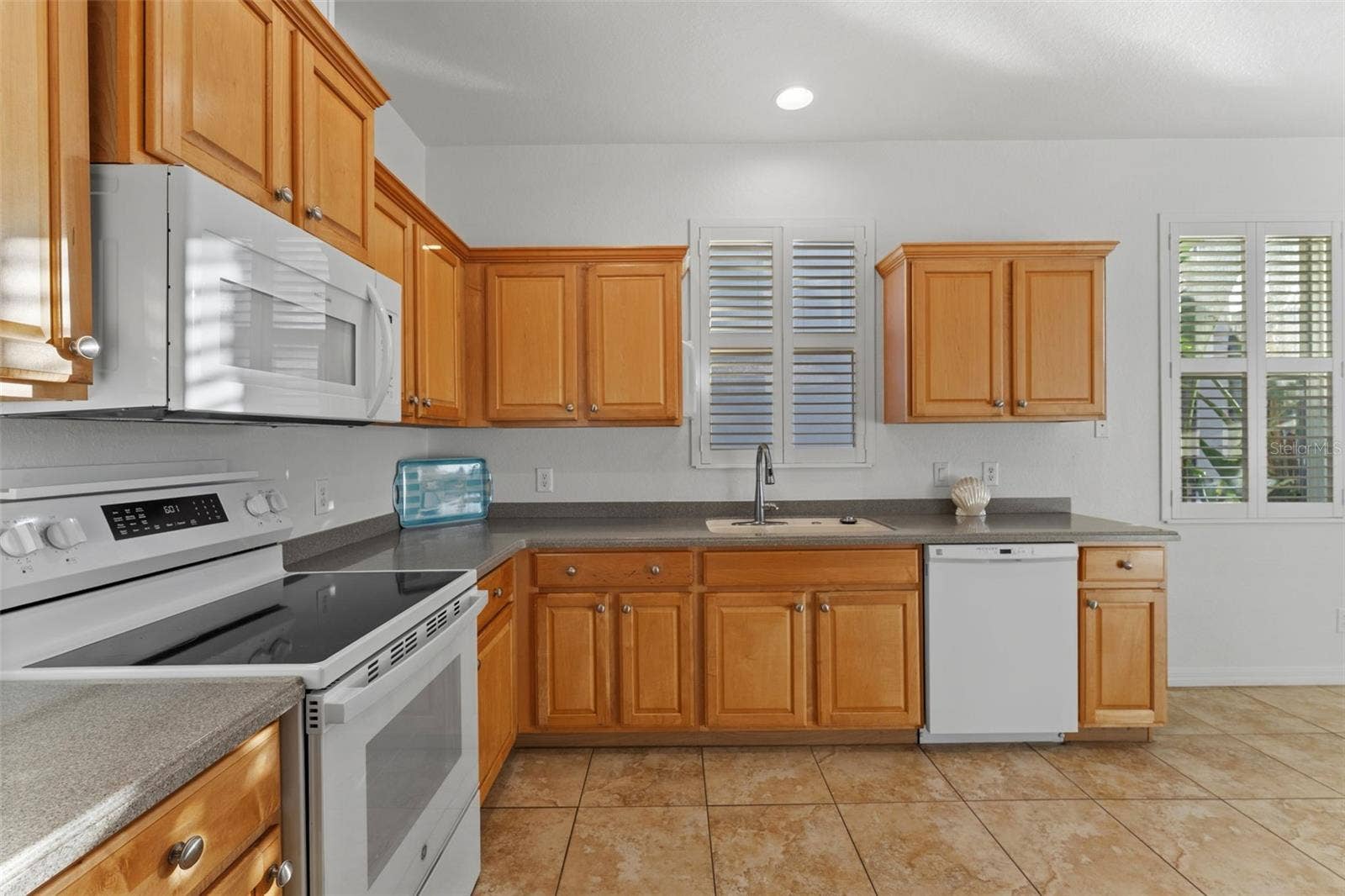 2216 WEAVER BIRD LANE, Venice, FL 34292 Around the corner from the Dining Room - Kitchen with Plantation Shutters