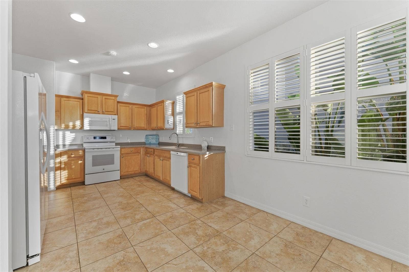 2216 WEAVER BIRD LANE, Venice, FL 34292 Eat-in Kitchen Space by window with Plantation Shutters