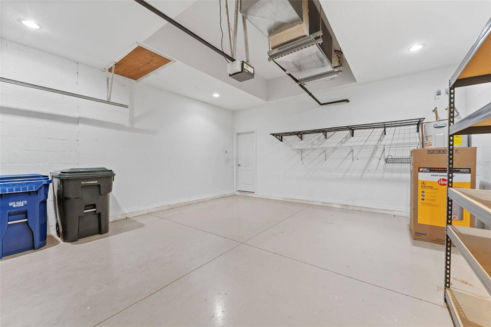 2216 WEAVER BIRD LANE, Venice, FL 34292 2-car garage with shelving