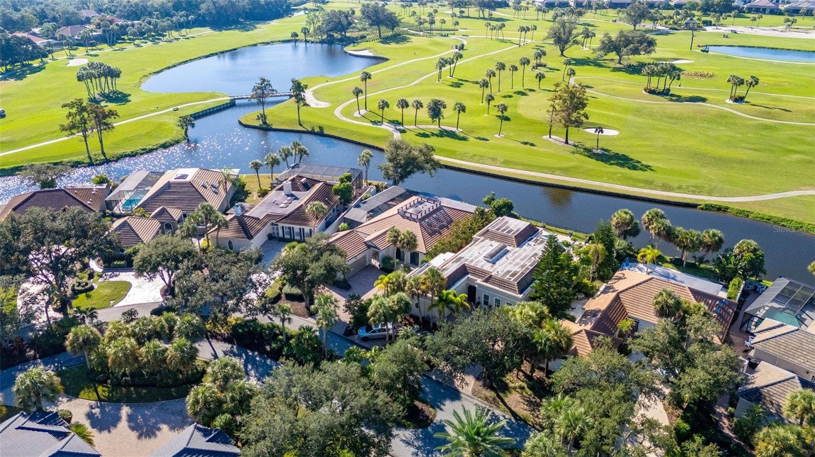 71 CAYMAN ISLES BOULEVARD, Englewood, FL 34223 aerial of house on golf course and pond