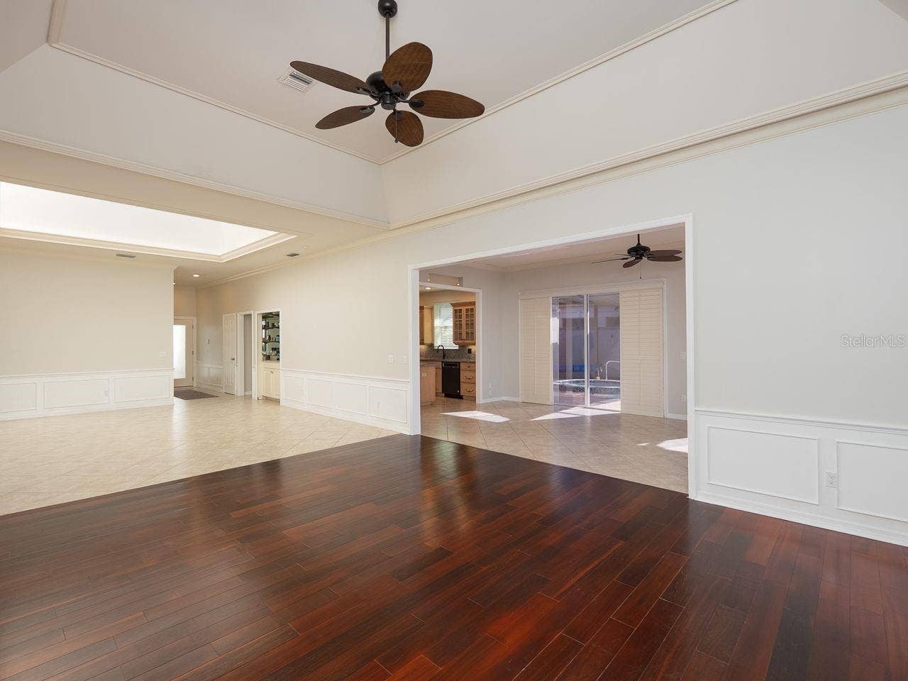 71 CAYMAN ISLES BOULEVARD, Englewood, FL 34223 Formal living room and dining with opening to family room and kitchen
