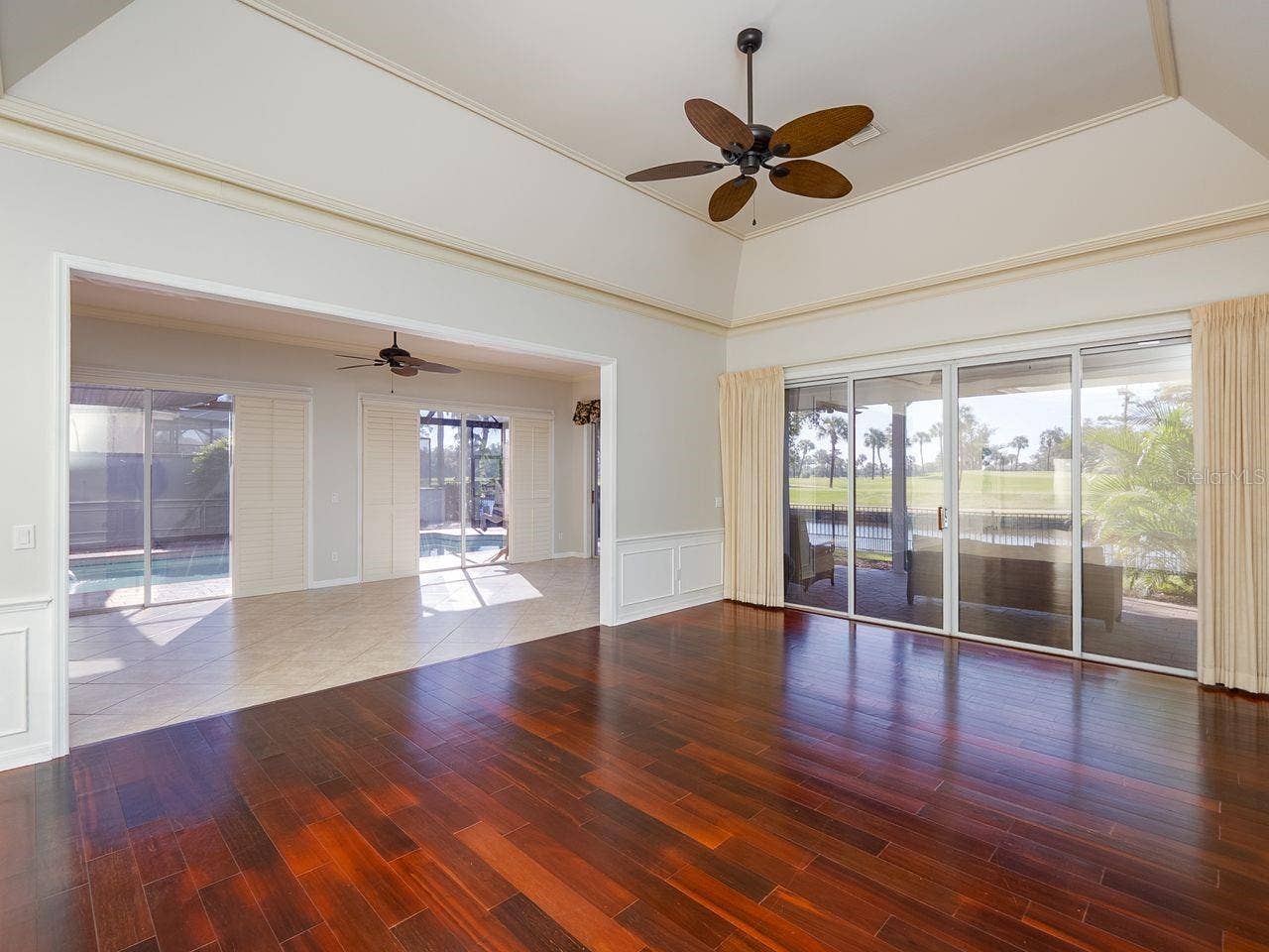 71 CAYMAN ISLES BOULEVARD, Englewood, FL 34223 Living room looking into family room