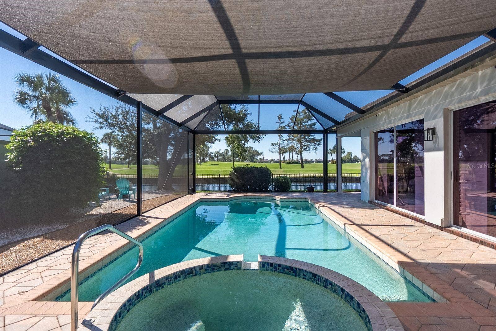 71 CAYMAN ISLES BOULEVARD, Englewood, FL 34223 pool and spa overlooking pond and golf course