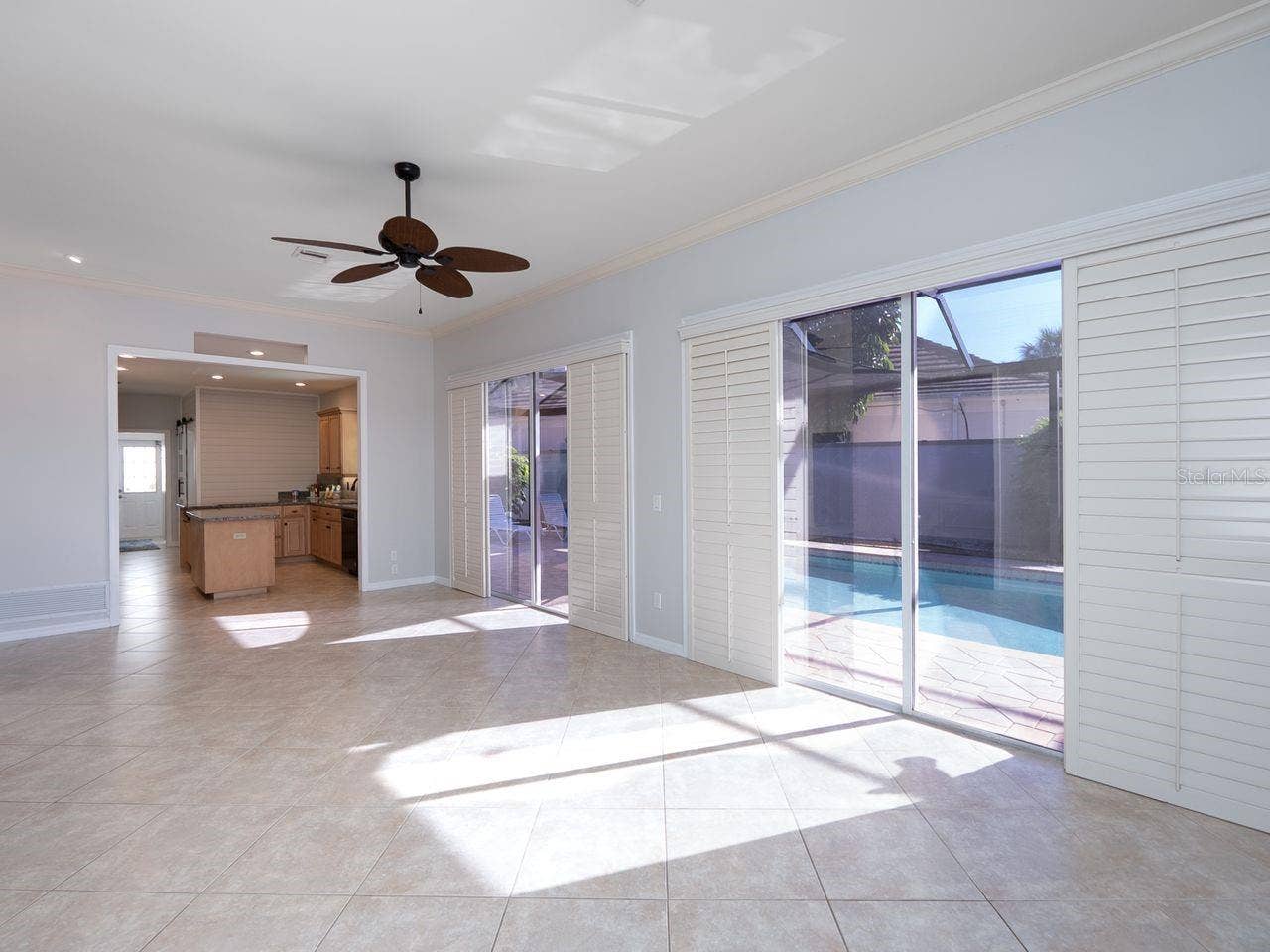 71 CAYMAN ISLES BOULEVARD, Englewood, FL 34223 Family room looking into kitchen