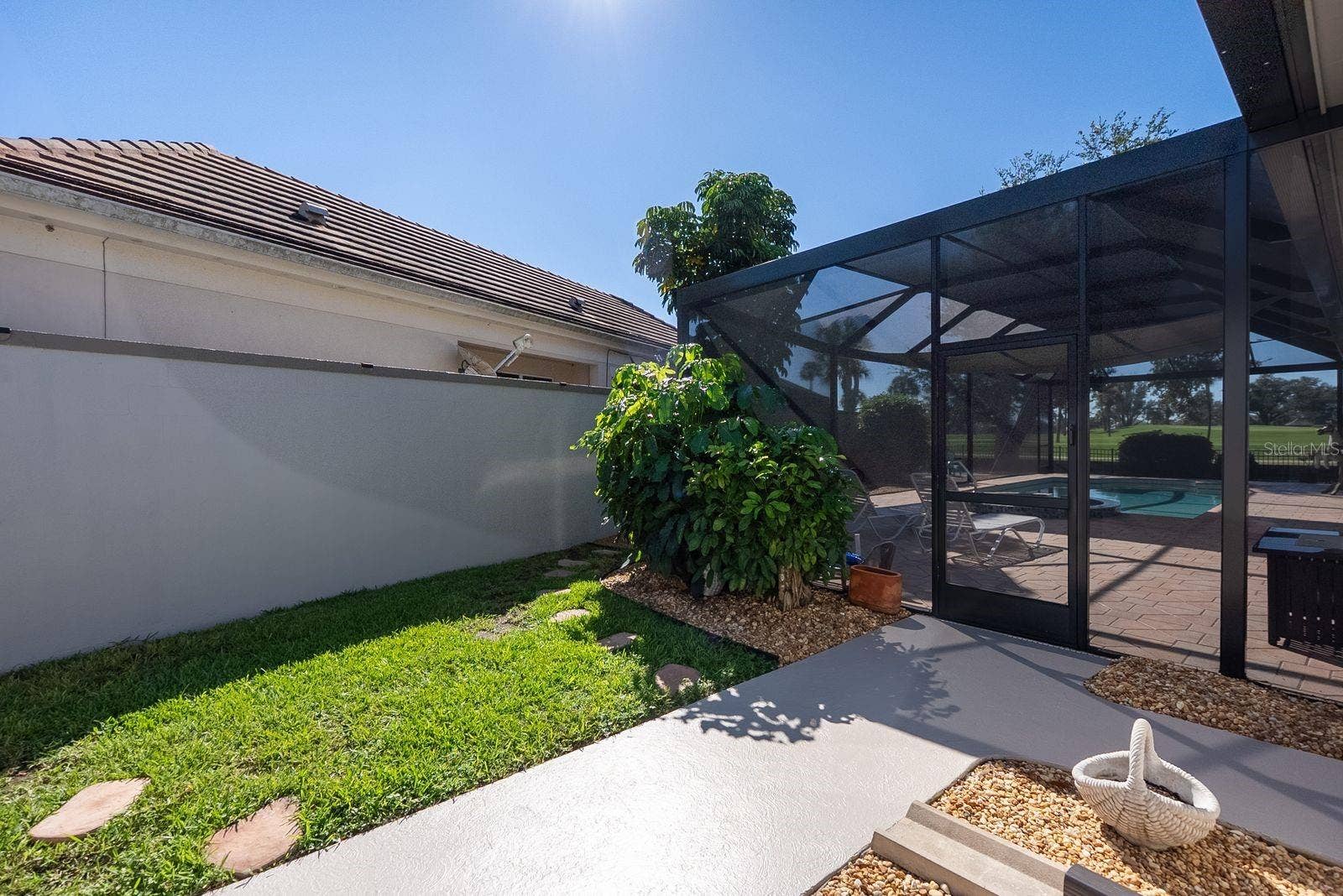 71 CAYMAN ISLES BOULEVARD, Englewood, FL 34223 side entrance into pool screen by 1/2 bath door