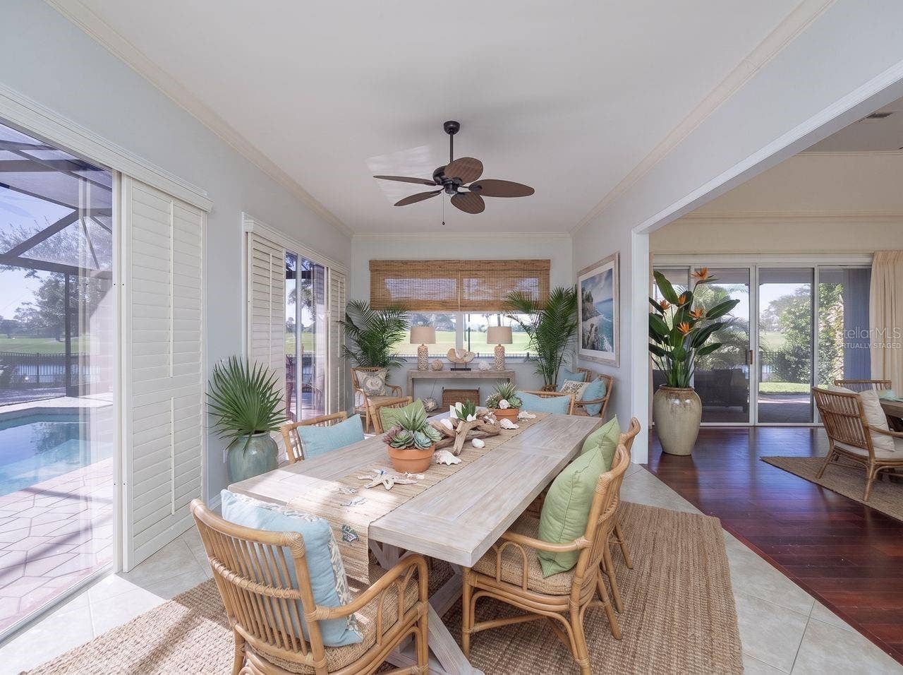 71 CAYMAN ISLES BOULEVARD, Englewood, FL 34223 family room virtually staged as a dining area