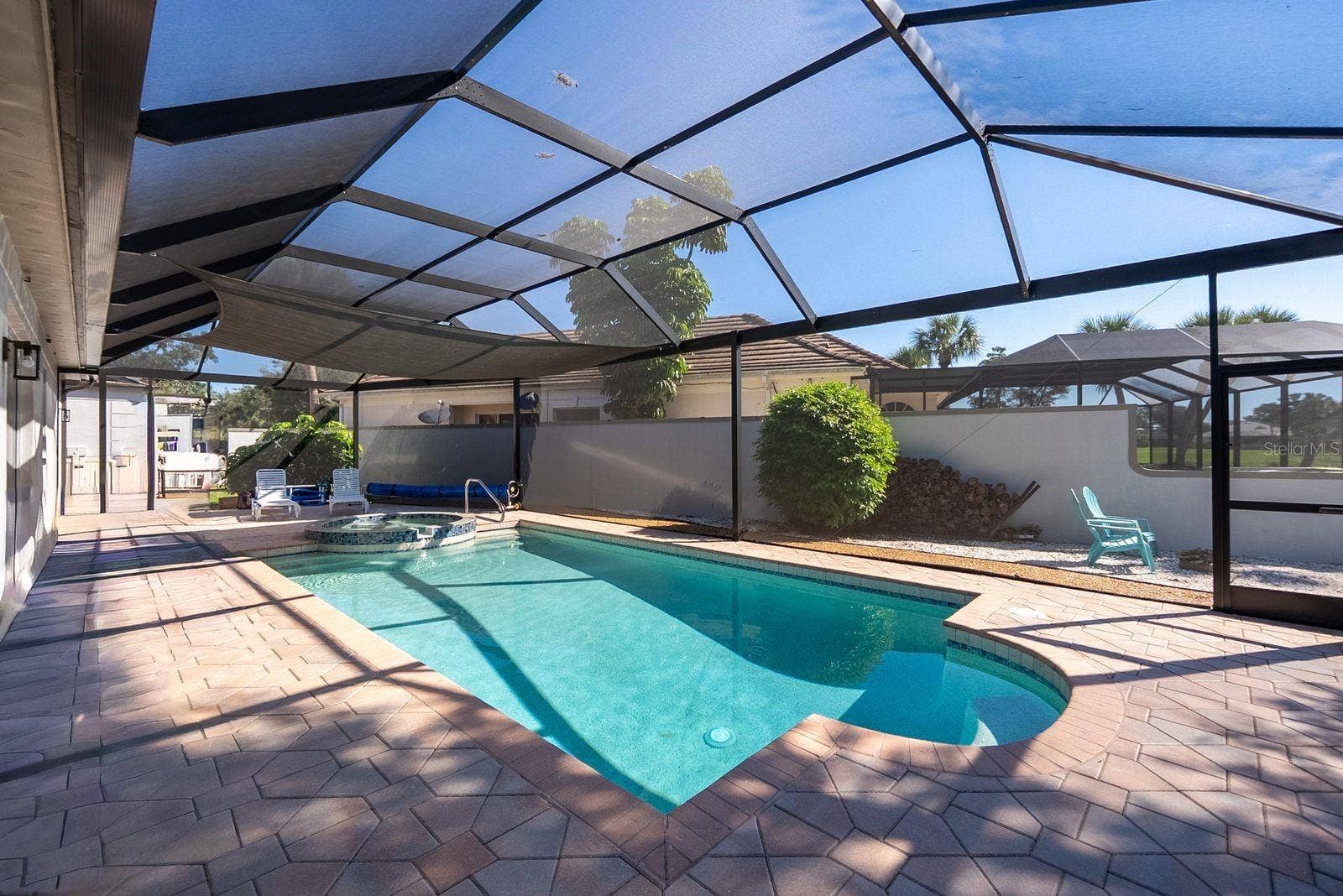 71 CAYMAN ISLES BOULEVARD, Englewood, FL 34223 pool area and firepit on side