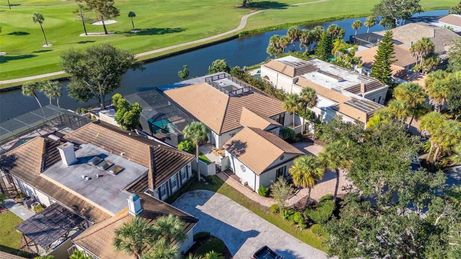 71 CAYMAN ISLES BOULEVARD, Englewood, FL 34223 aerial of house and pond