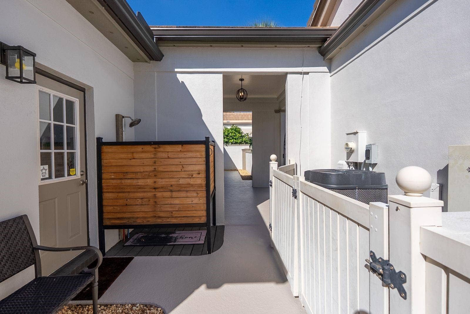 71 CAYMAN ISLES BOULEVARD, Englewood, FL 34223 Outside shower by laundry room door on side of house