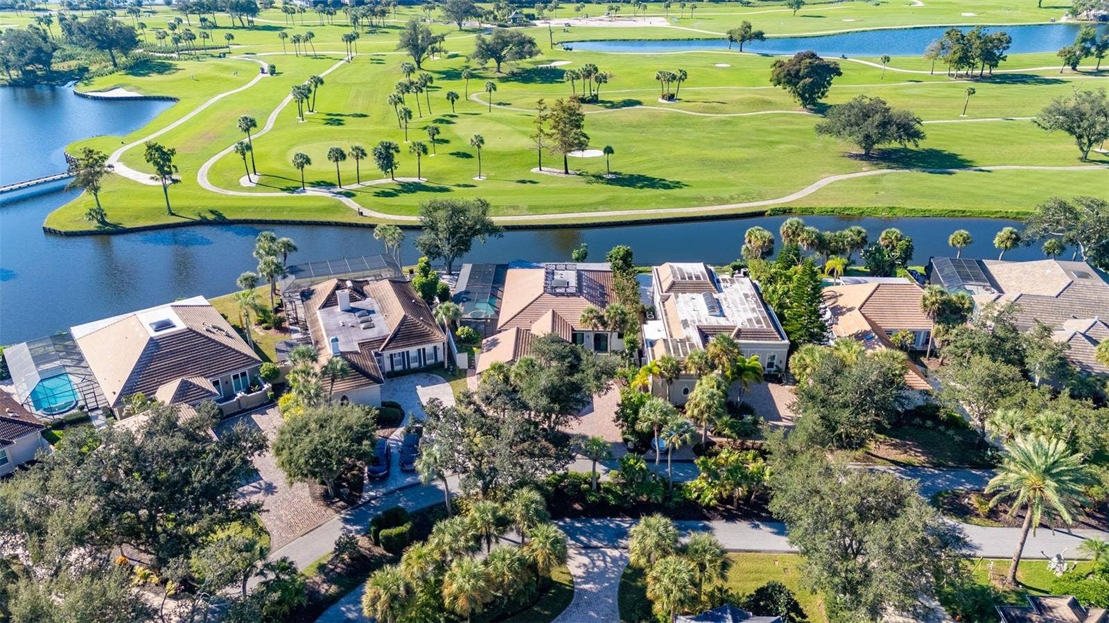 71 CAYMAN ISLES BOULEVARD, Englewood, FL 34223 aerial of house on golf course and pond