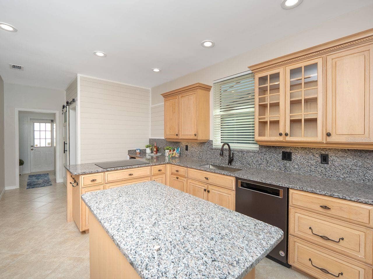 71 CAYMAN ISLES BOULEVARD, Englewood, FL 34223 kitchen looking toward laundry room and side door