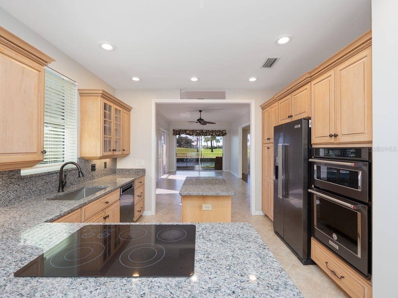 71 CAYMAN ISLES BOULEVARD, Englewood, FL 34223 Kitchen looking toward family room