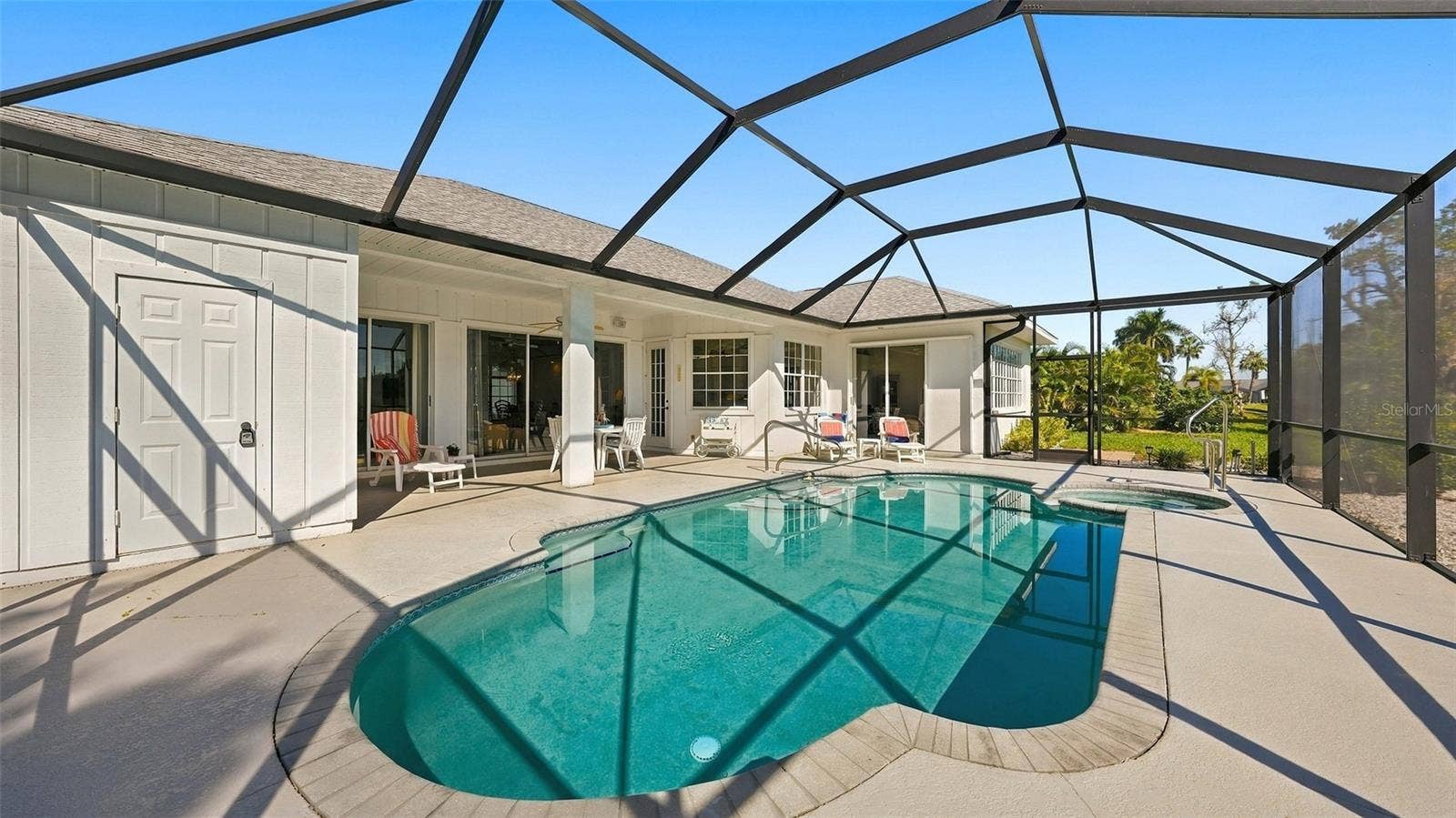 12 MEDALIST COURT, Rotonda West, FL 33947 notice the storage room door just off from pool