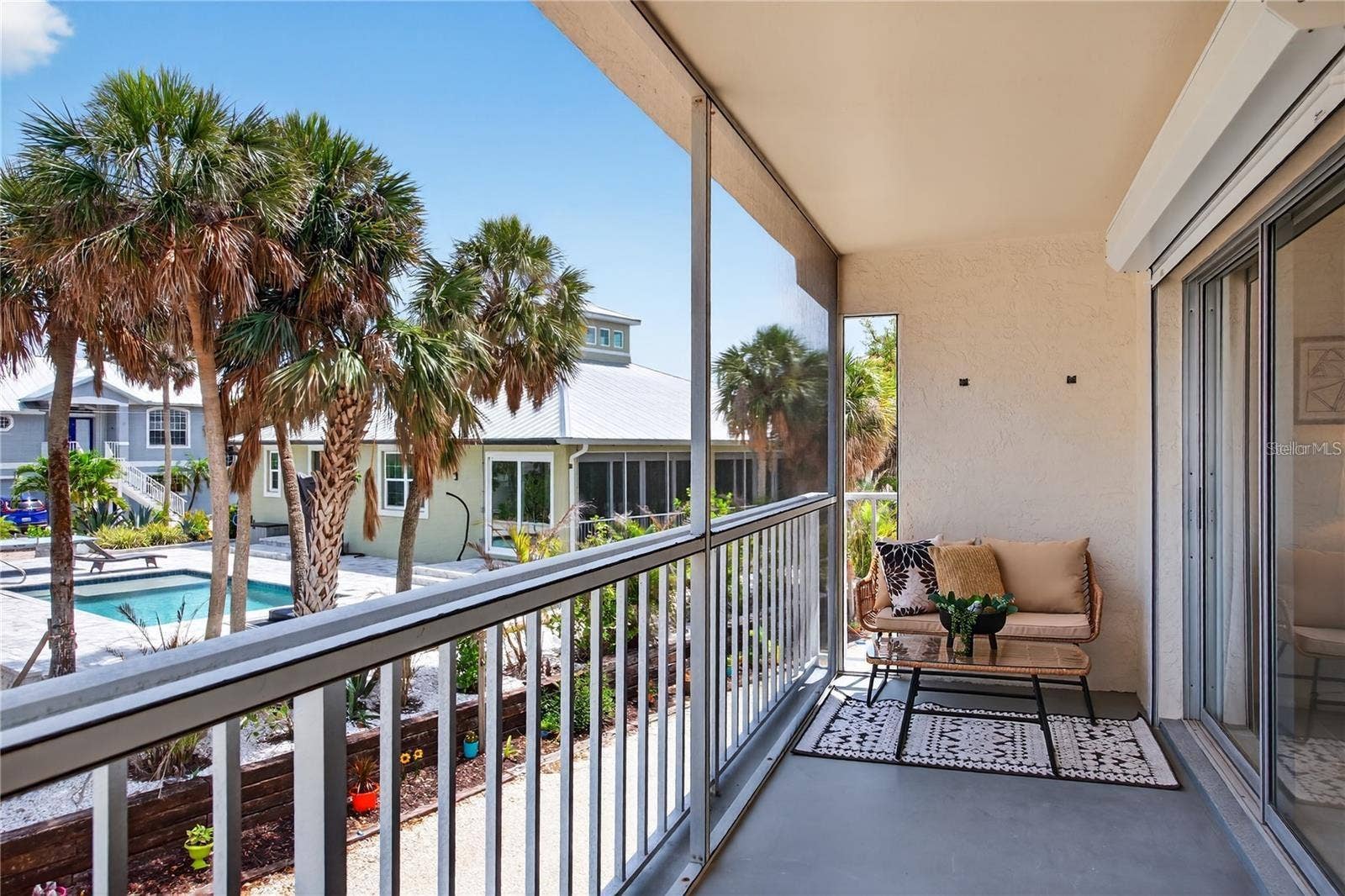5031 N BEACH ROAD, #118, Englewood, FL 34223 Lanai Directly Off of Living Room and Primary Bedroom with Peekaboo Views to Lemon Bay