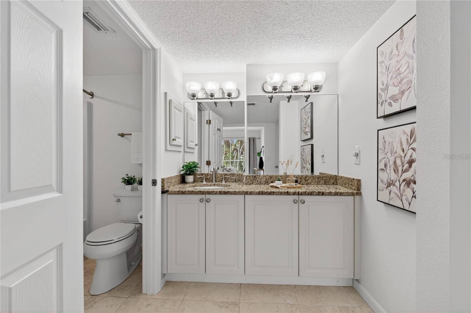 5031 N BEACH ROAD, #118, Englewood, FL 34223 Primary Bathroom with Large Granite-Topped Vanity