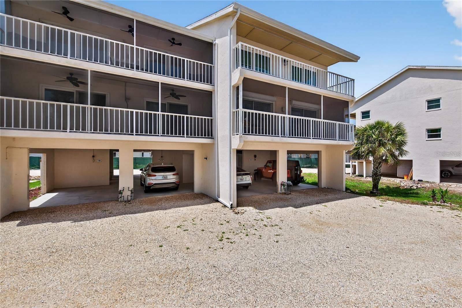 5031 N BEACH ROAD, #118, Englewood, FL 34223 View of Condo Parking Underneath Building