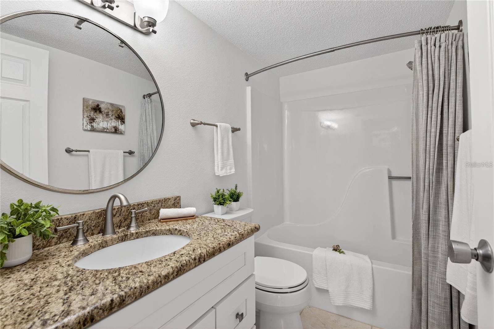 5031 N BEACH ROAD, #118, Englewood, FL 34223 Second Bathroom with Granite-Topped Vanity and Tub and Shower Combination