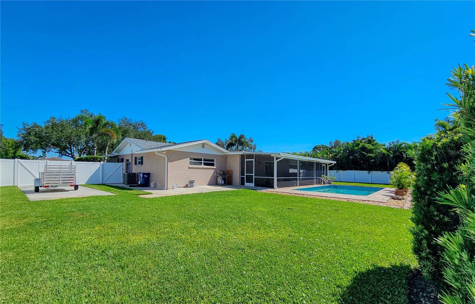 2304 50TH STREET W, Bradenton, FL 34209 Fenced in Backyard from shed with RV/Boating parking pad behind double door fence