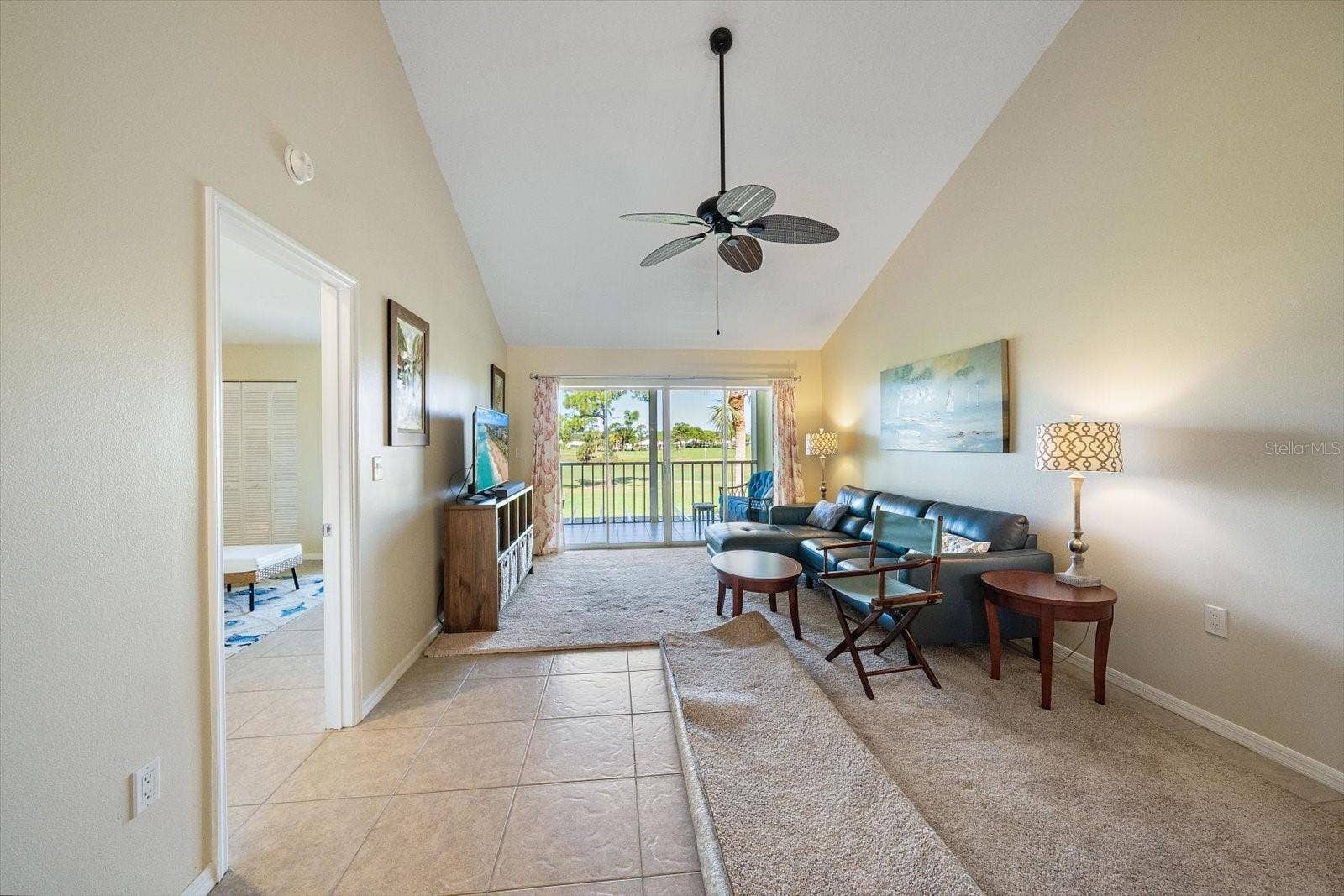439 CERROMAR LANE, #410, Venice, FL 34293 Title throughout the property. Seller prefers carpets so he has some foldable rugs.