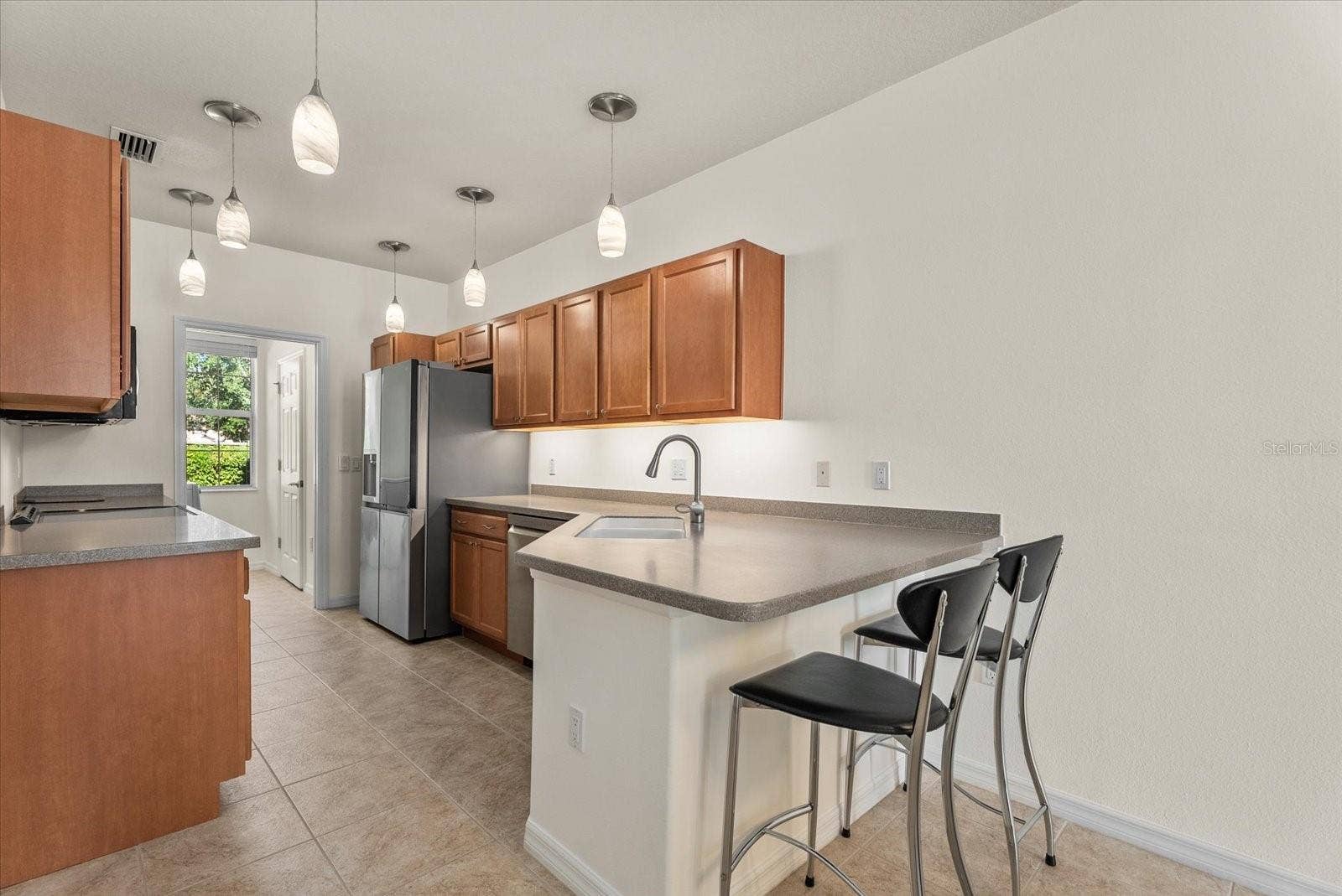 3810 82ND AVENUE CIRCLE E, #104, Sarasota, FL 34243 Kitchen with Breakfast Bar