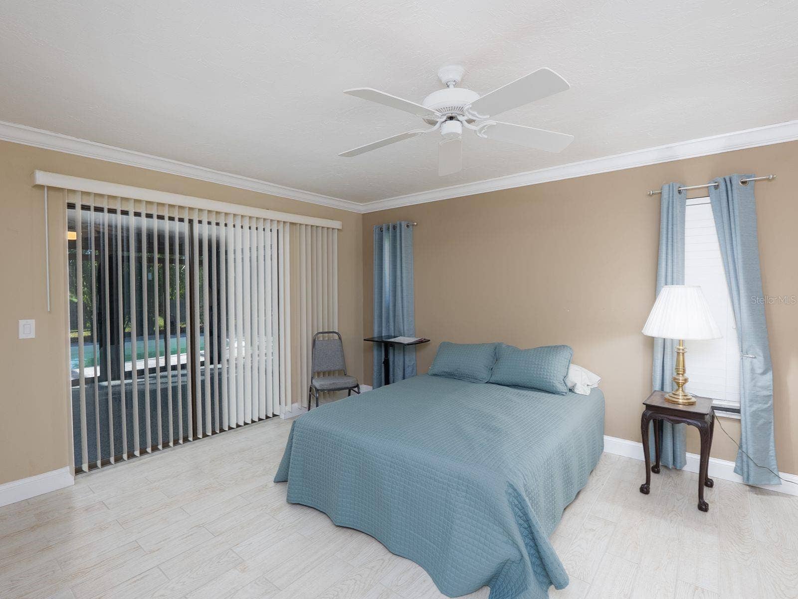 primary bedroom with slider to fl room-lanai