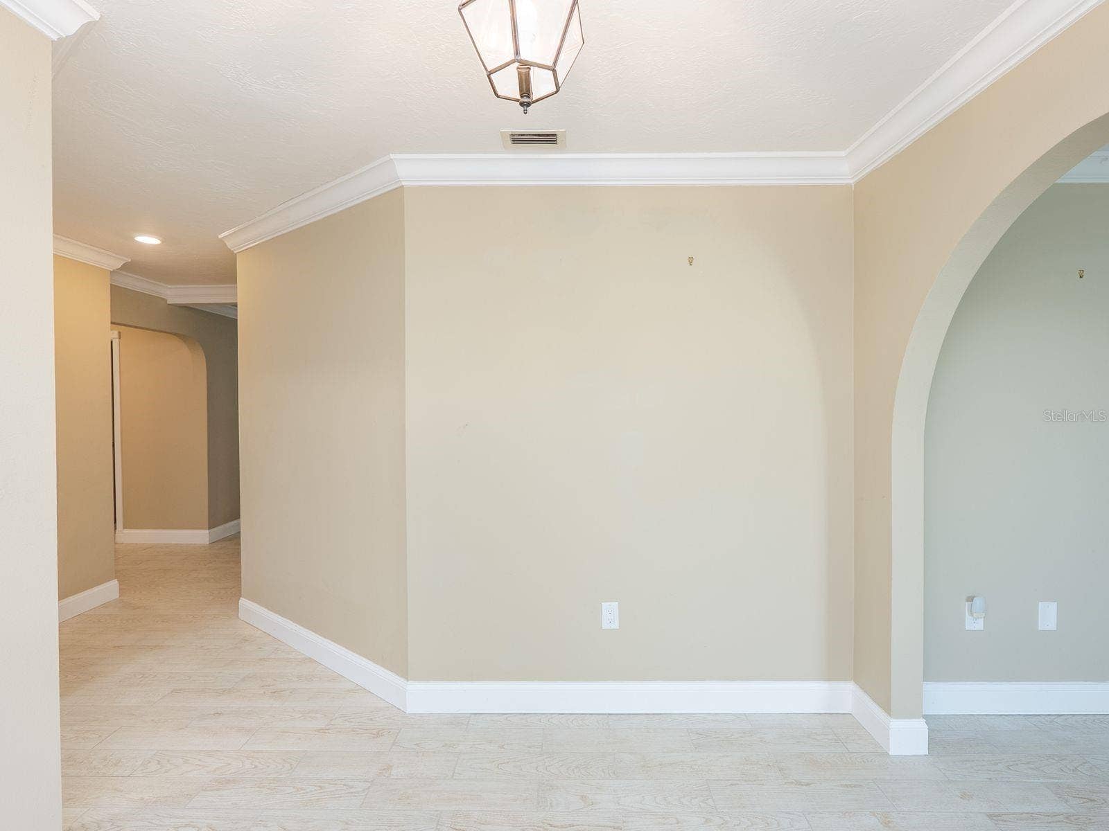 looking from foyer toward living room and dining