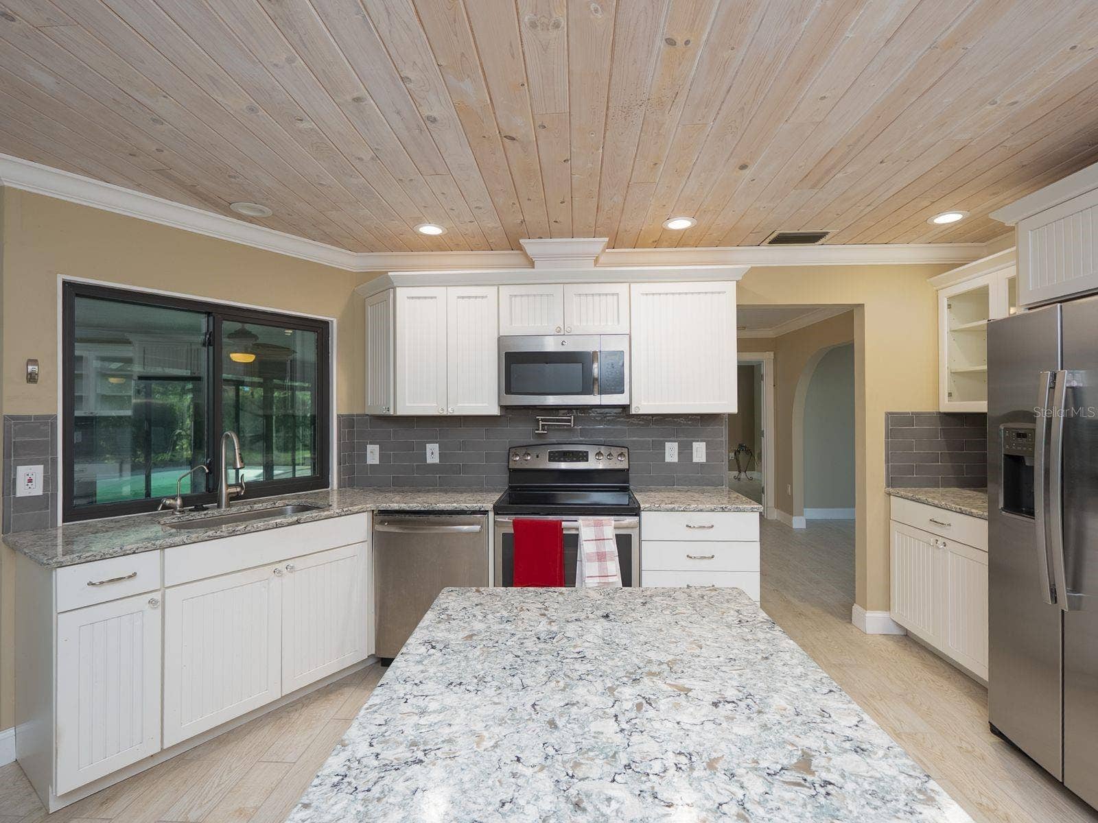 kitchen with passthrough to fl room- lanai
