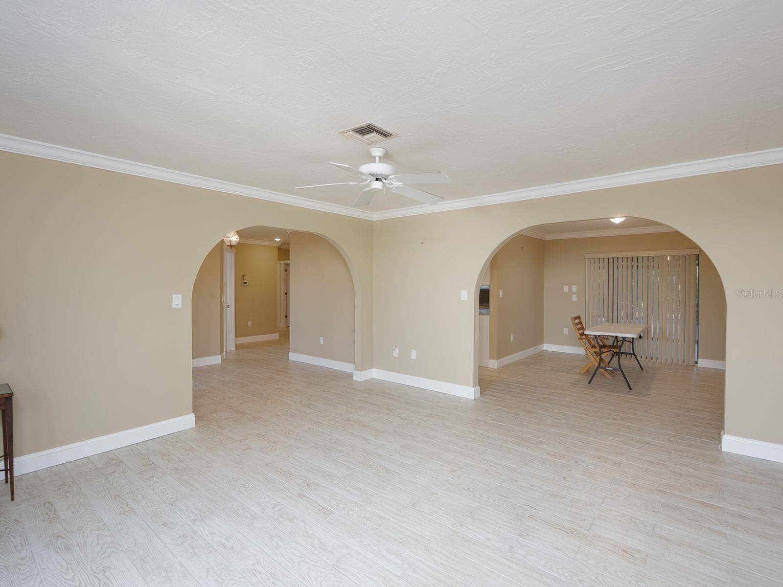 living room looking toward foyer left and dining right