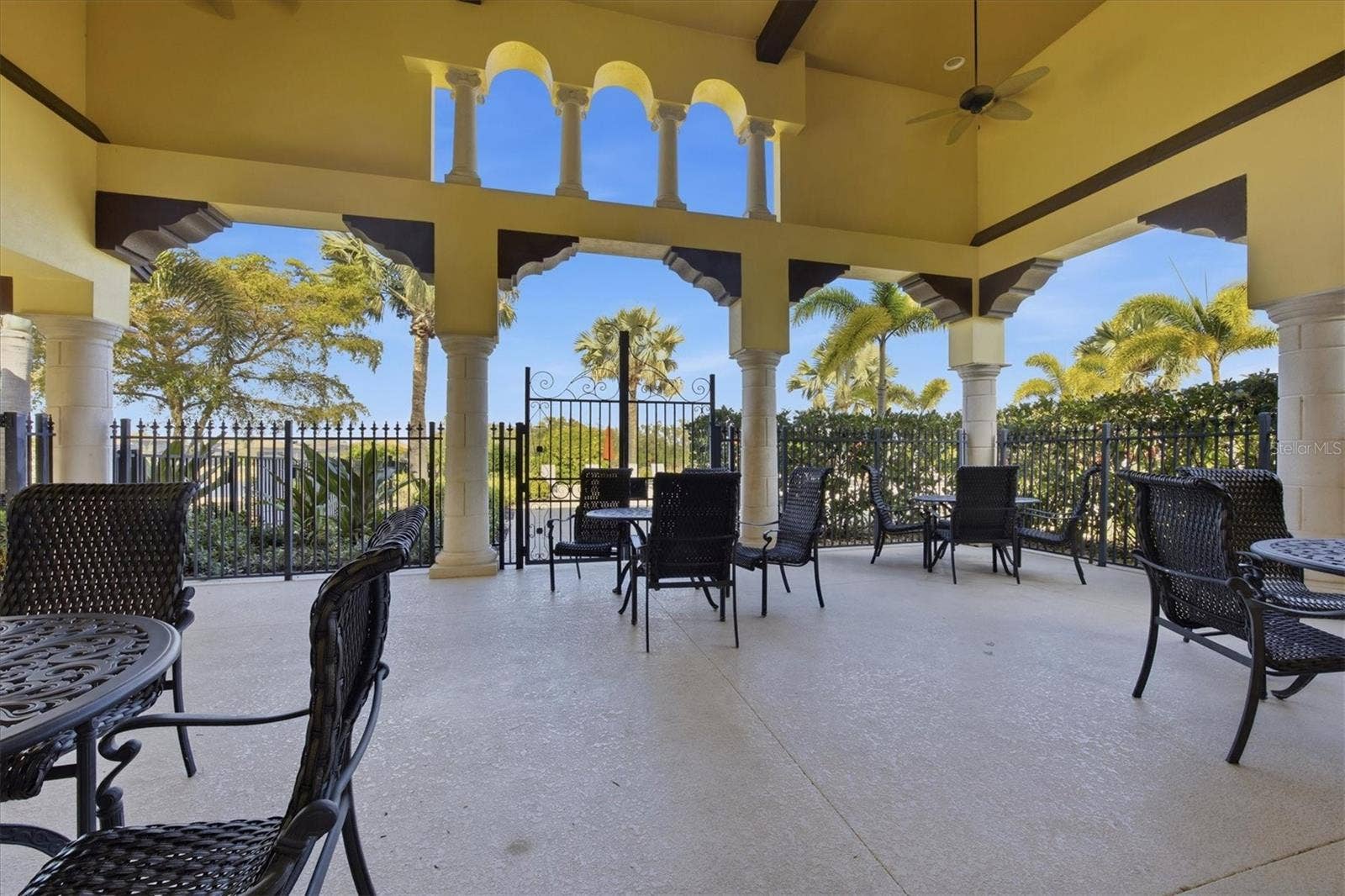 19946 BENISSIMO DRIVE, Venice, FL 34293 Covered Loggia with Fireplace Overlooking the Pool