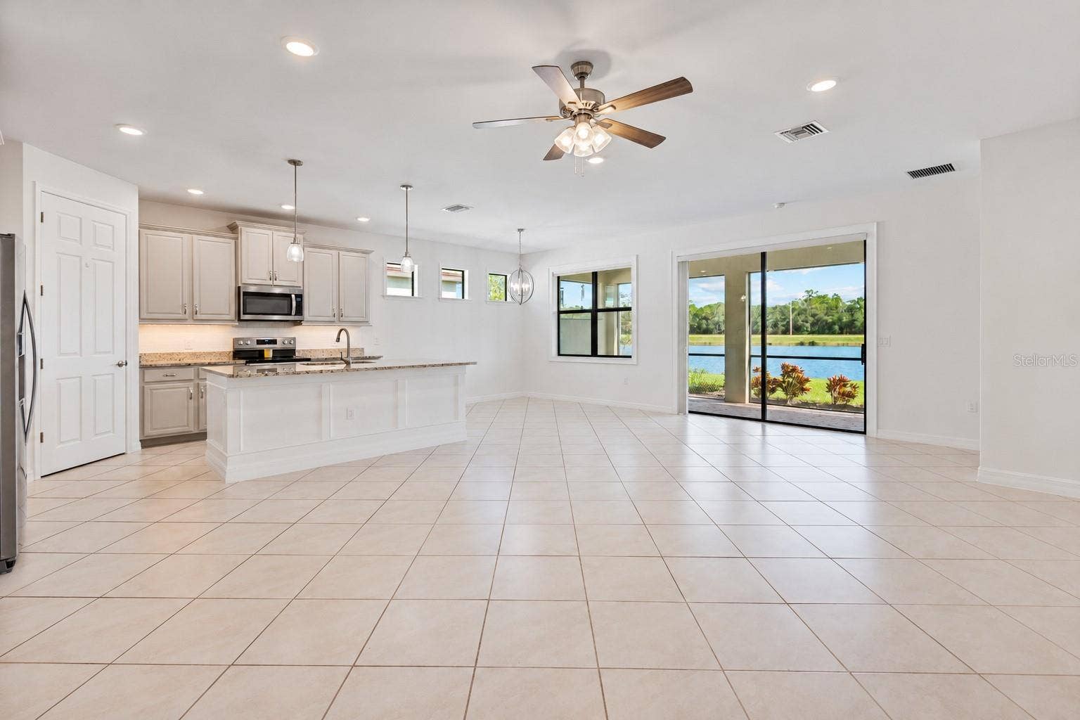 20846 FETTERBUSH PLACE, Venice, FL 34293 Open concept living / dining / kitchen