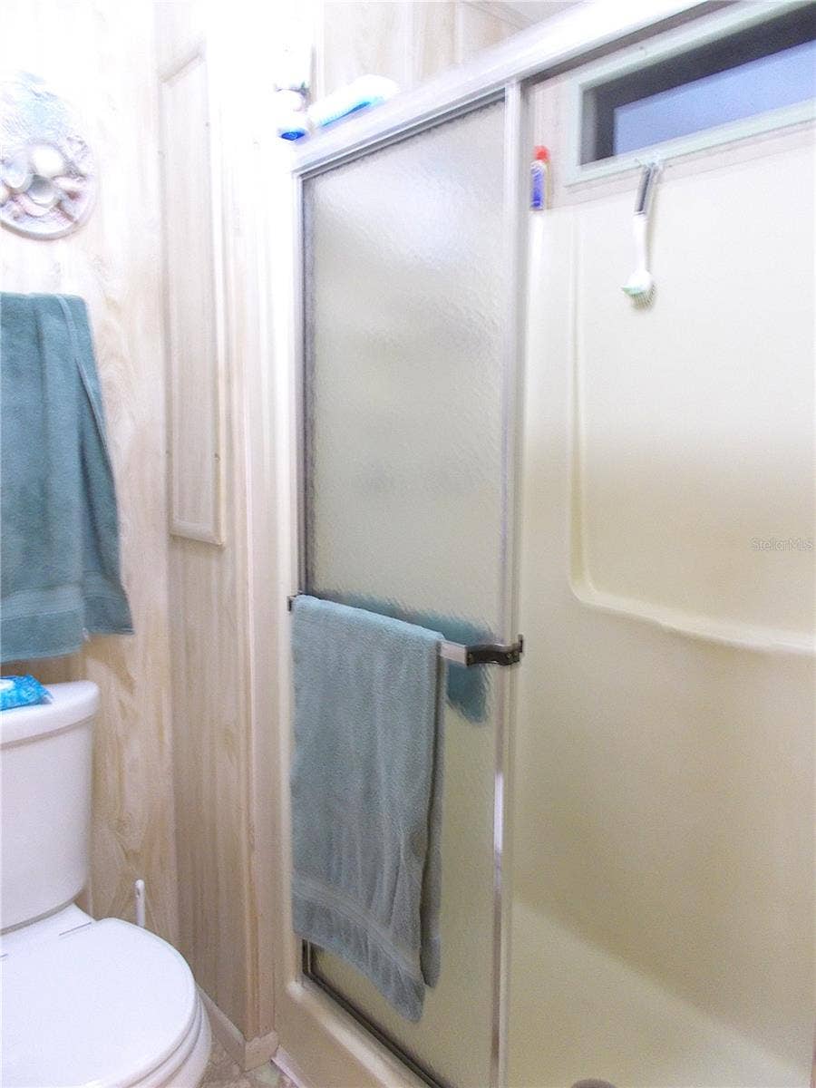525 SANDPIPER DRIVE, Venice, FL 34285 Ensuite bathroom walk-in shower & comode