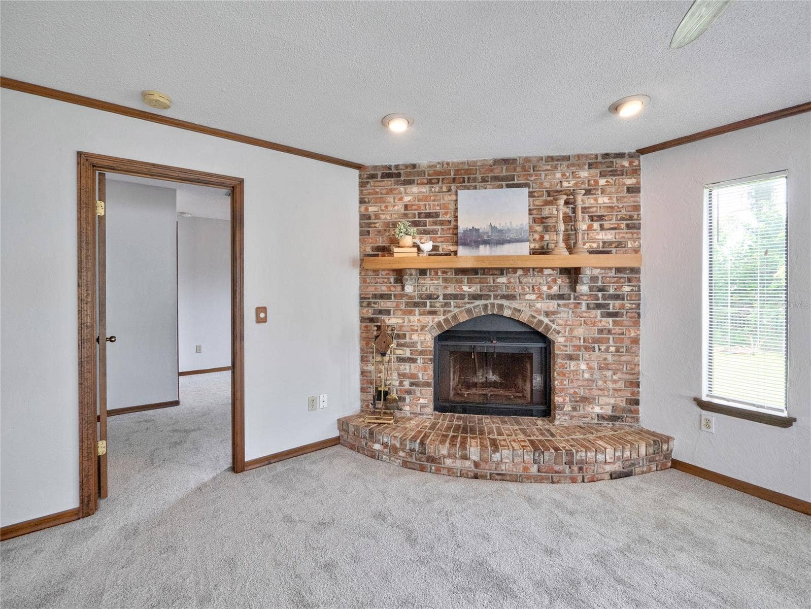 South Daytona, FL 32119 Wood burning fireplace with beautiful brick surround