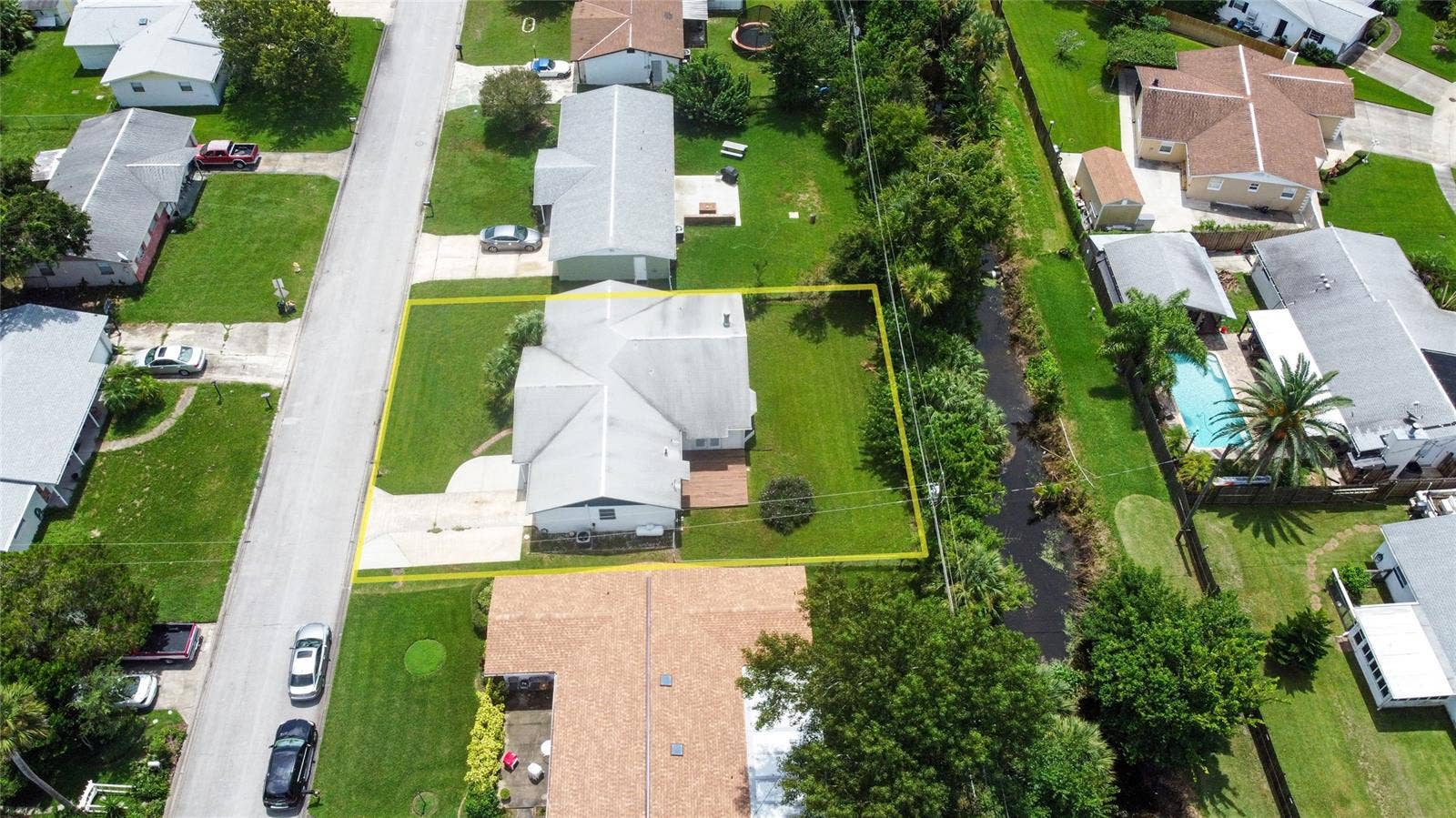 South Daytona, FL 32119 A creek runs behind the home between it and the adjacent property, giving a little extra privacy!