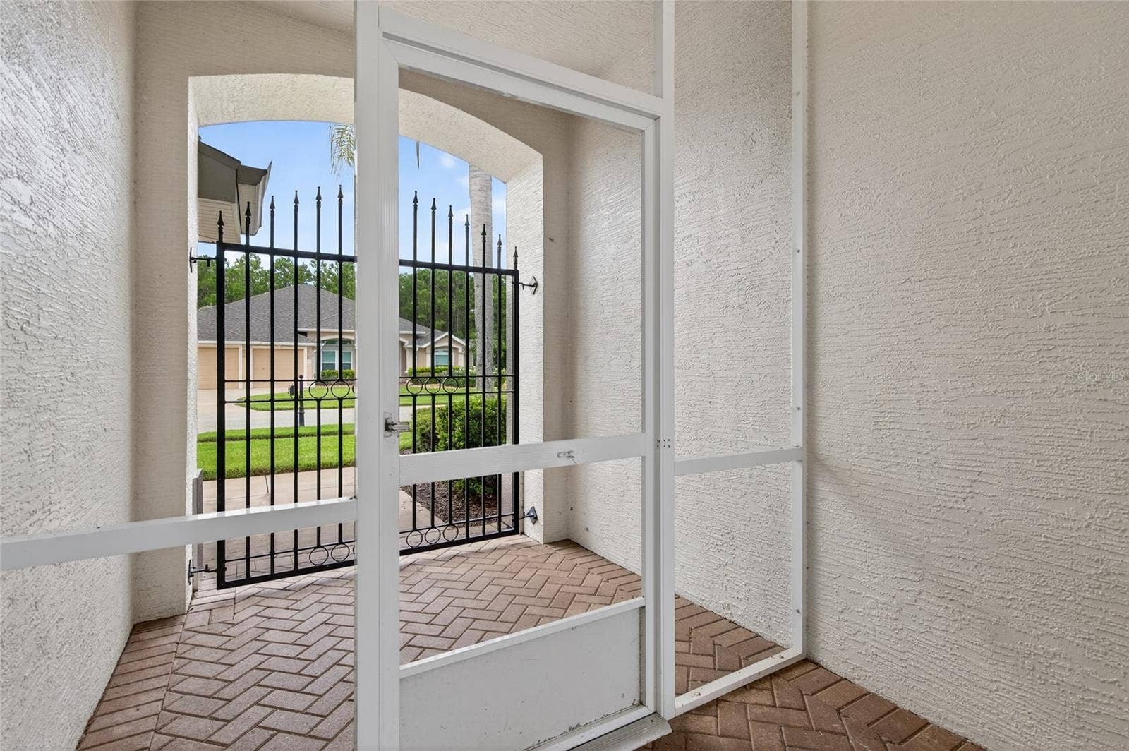 5415 SWORDFERN COURT, Port Orange, FL 32128 Front Entryway to courtyard and then courtyard to main