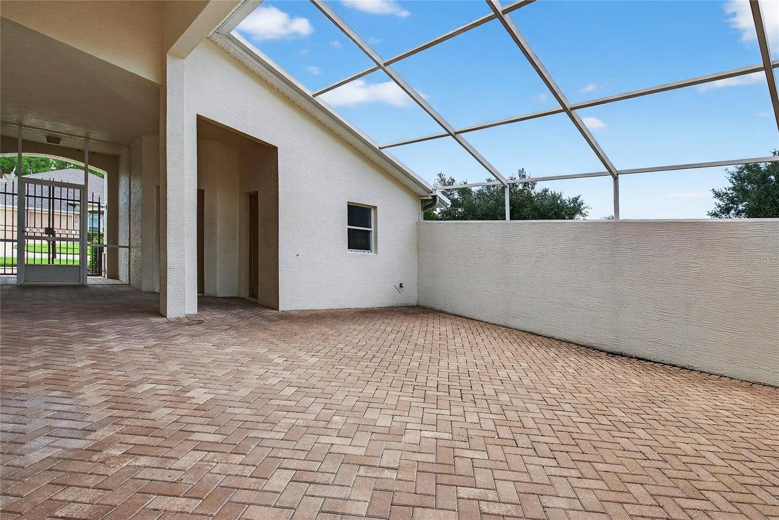 5415 SWORDFERN COURT, Port Orange, FL 32128 Courtyard looking towards courtyard room and bath and entry