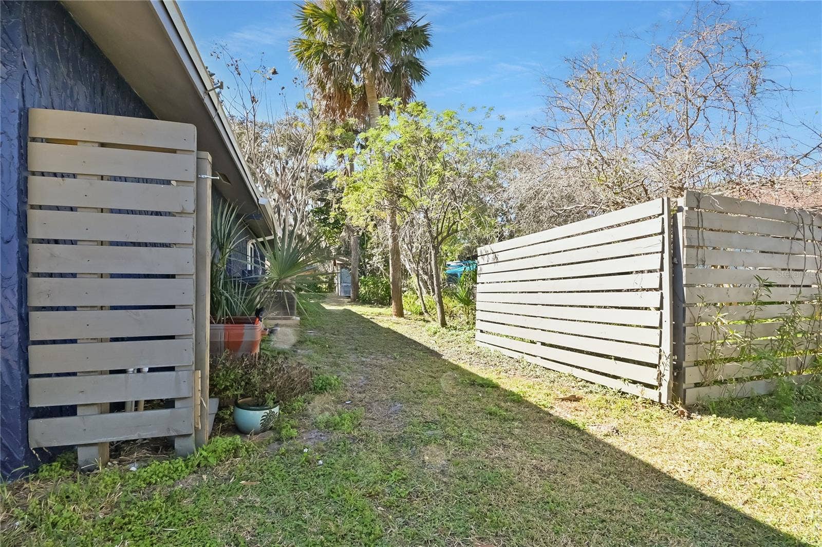 5820 RIVERSIDE DRIVE, Port Orange, FL 32127 Double gate allows for boat or RV parking in the sideyard.
