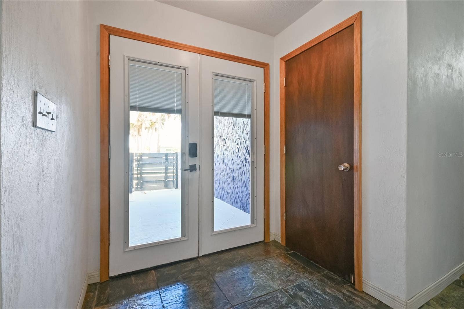 5820 RIVERSIDE DRIVE, Port Orange, FL 32127 Foyer with French Doors and Coat Closet
