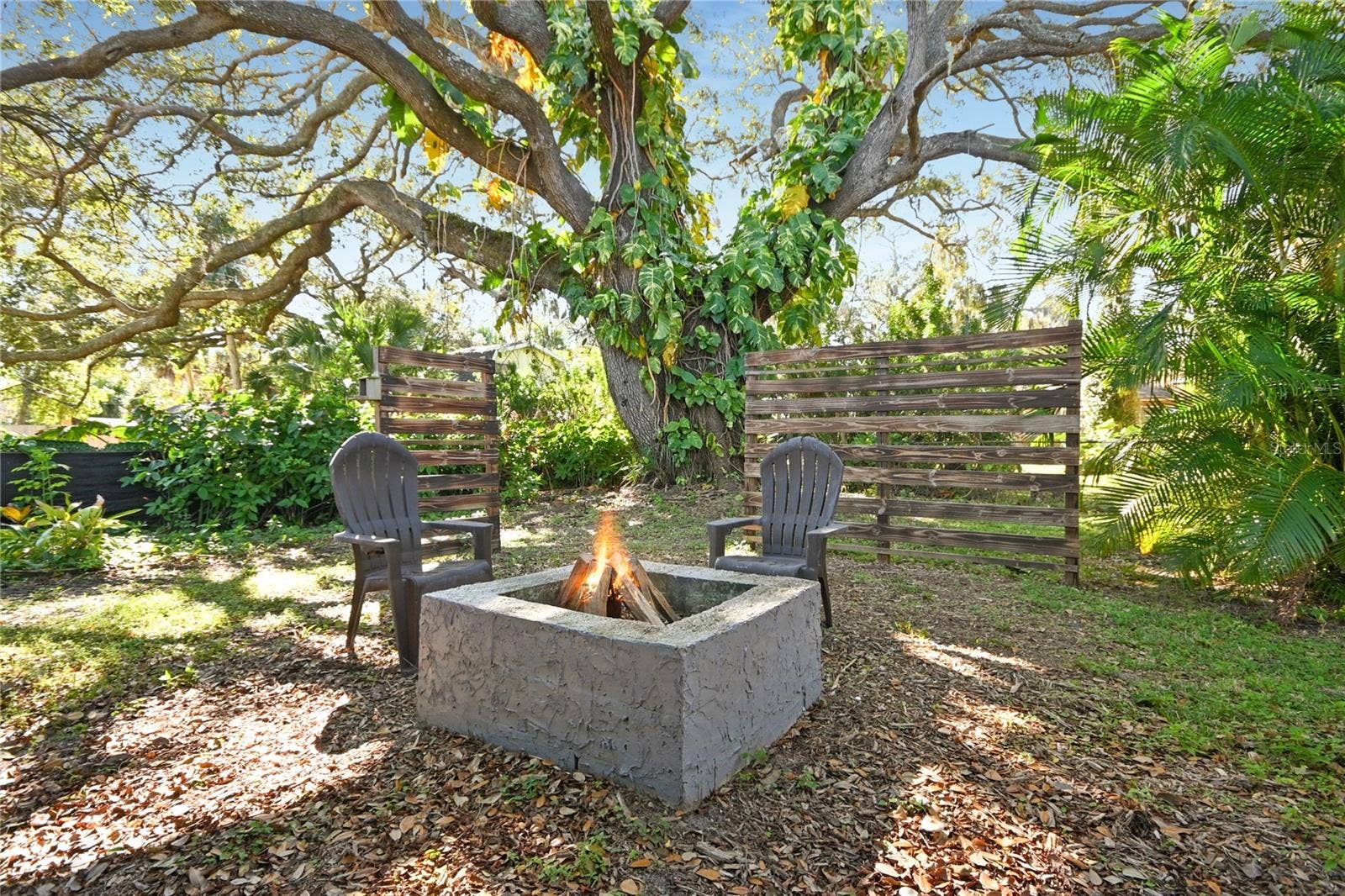 5820 RIVERSIDE DRIVE, Port Orange, FL 32127 Garden like backyard with a beautiful historic live oak tree.