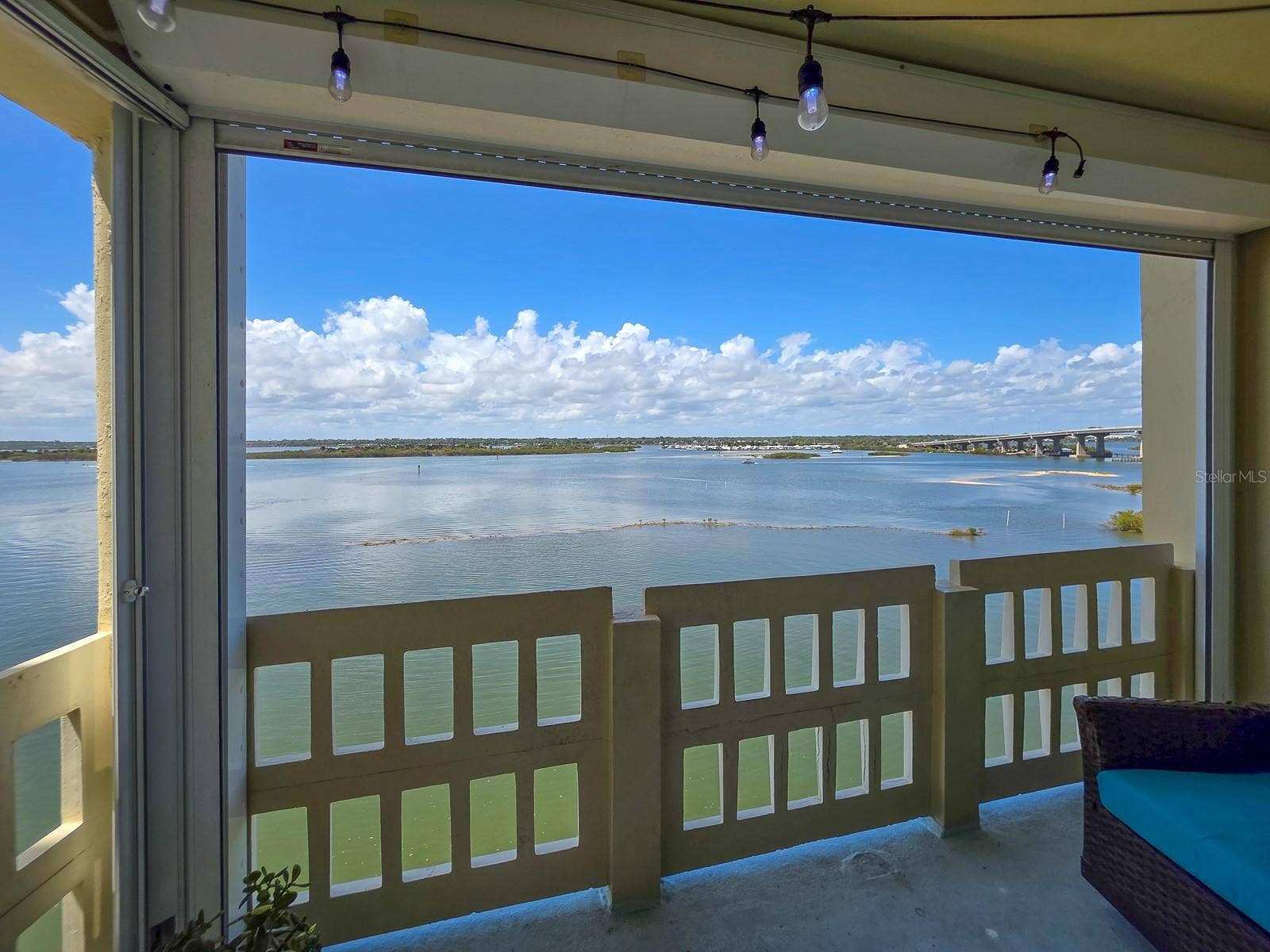3606 S PENINSULA DRIVE, #605, Port Orange, FL 32127 Covered balcony with electric storm shutters.