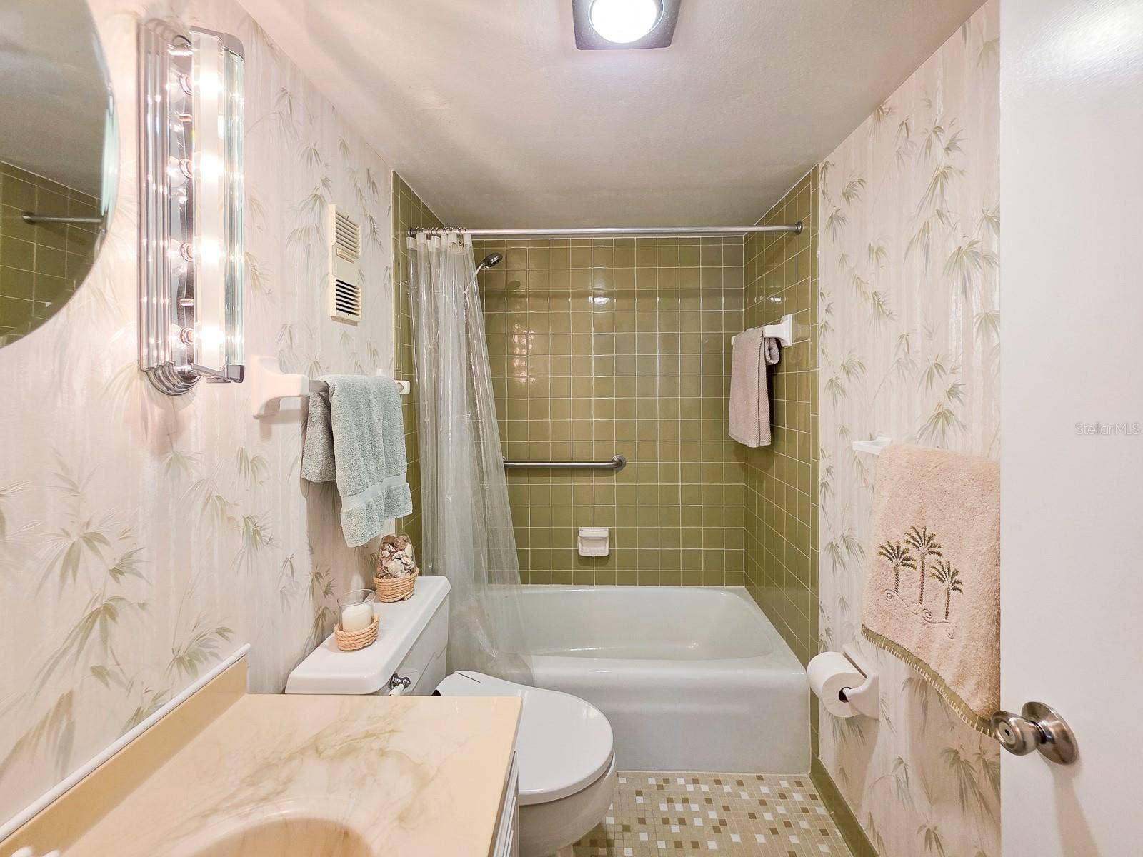 3606 S PENINSULA DRIVE, #605, Port Orange, FL 32127 Guest Bathroom with tub, shower and bidet.