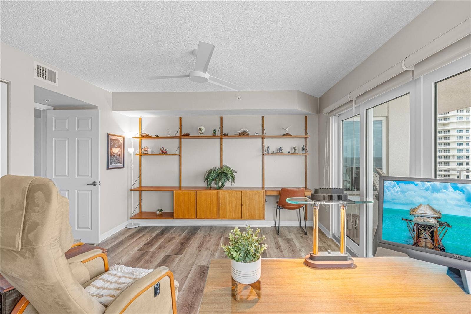 2967 S ATLANTIC AVENUE, #903, Daytona Beach Shores, FL 32118 Guest Bed 1 with vinyl flooring. Sliders to Balcony. Teak Shelving does not convey