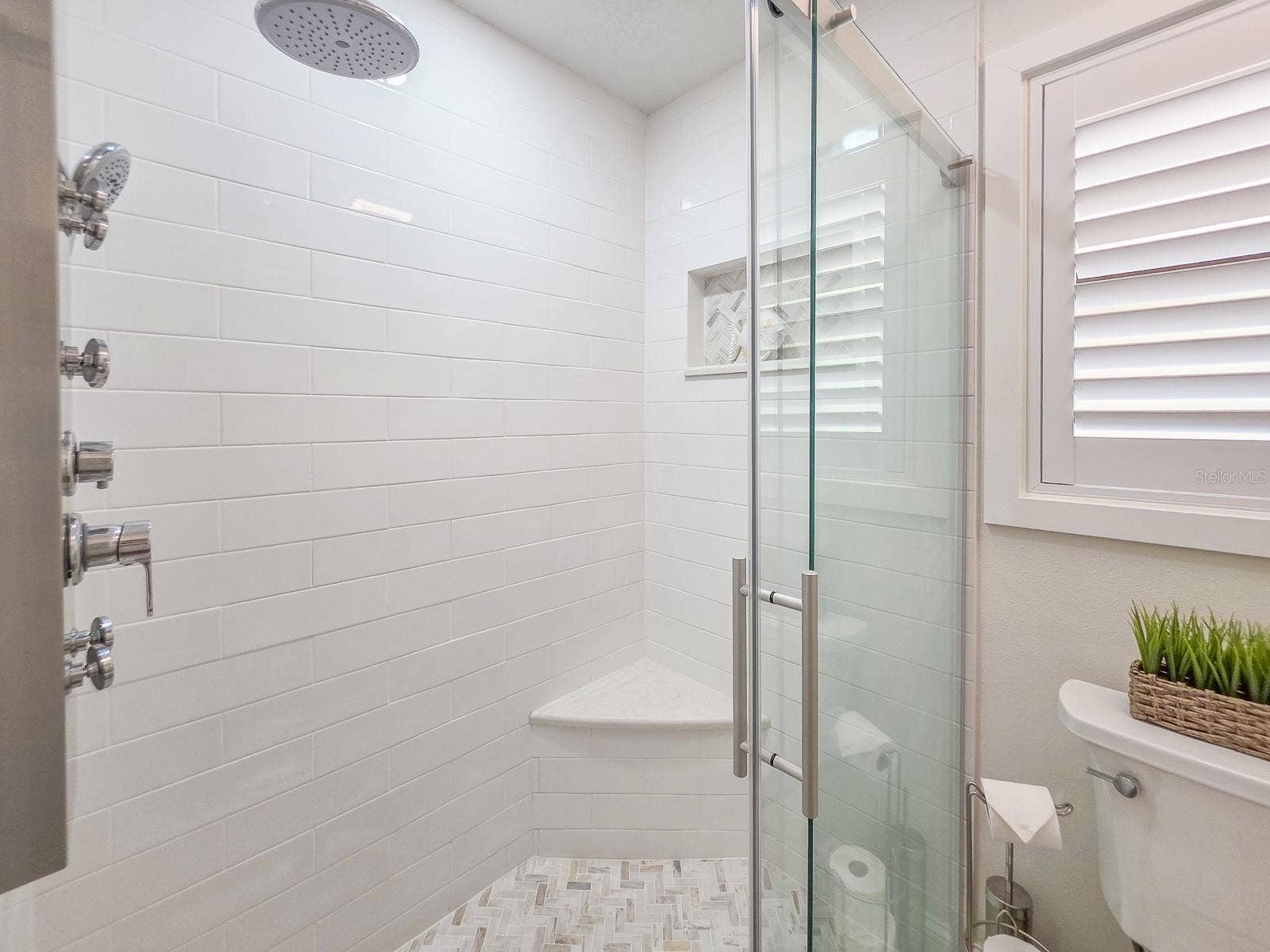 Luxury rain shower system w/ built in bench.