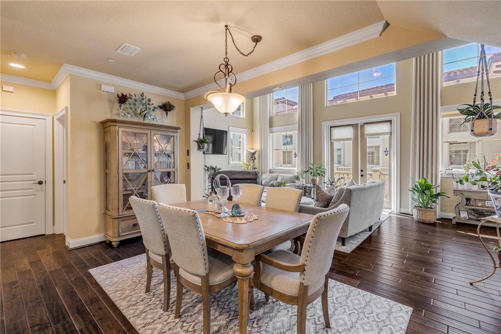 5090 RIVERSIDE DRIVE, #105, Port Orange, FL 32127 Hardwood floors, natural light, and crown molding.