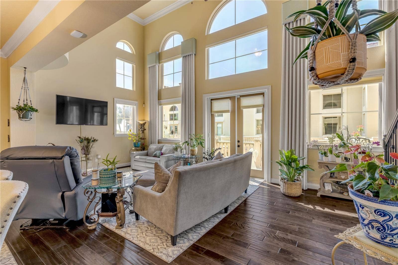 5090 RIVERSIDE DRIVE, #105, Port Orange, FL 32127 20 foot ceilings in living room with natural light