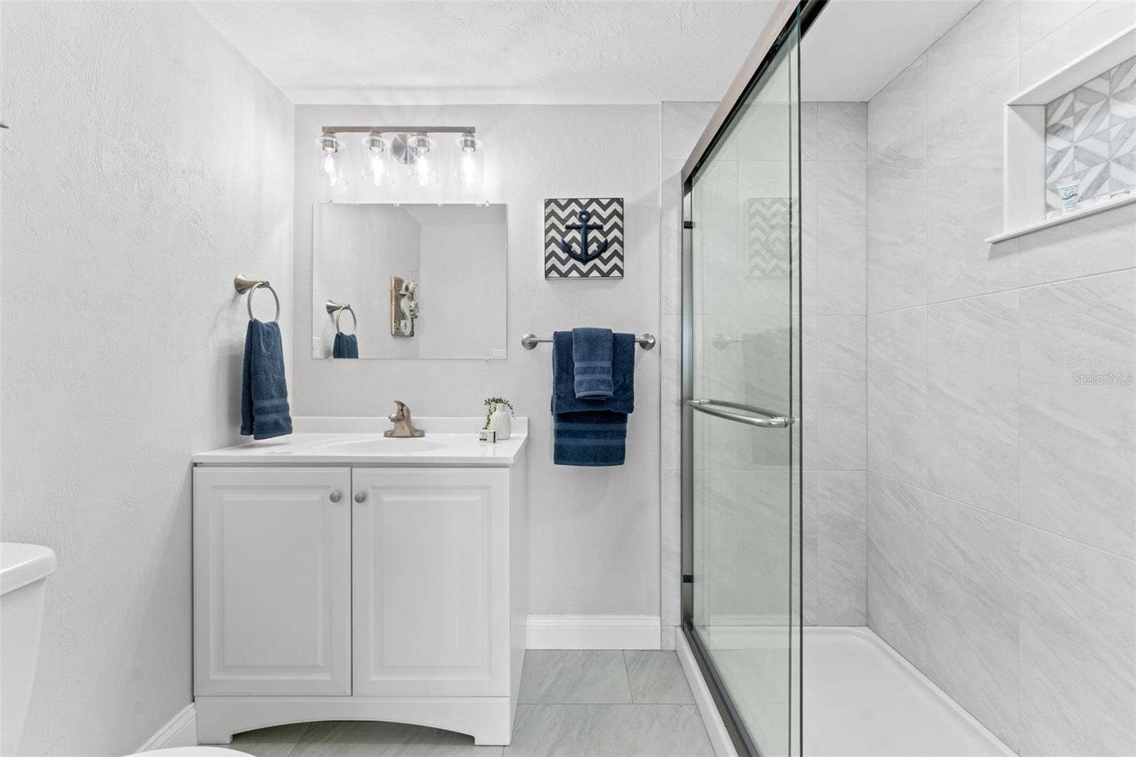 3606 S PENINSULA DRIVE, #102, Port Orange, FL 32127 Bathroom with walk-in shower.